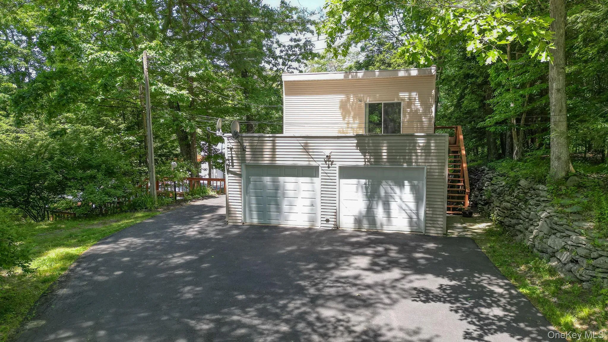 view of the garage and upstairs studio apartment view of the garage and upstairs studio apartment