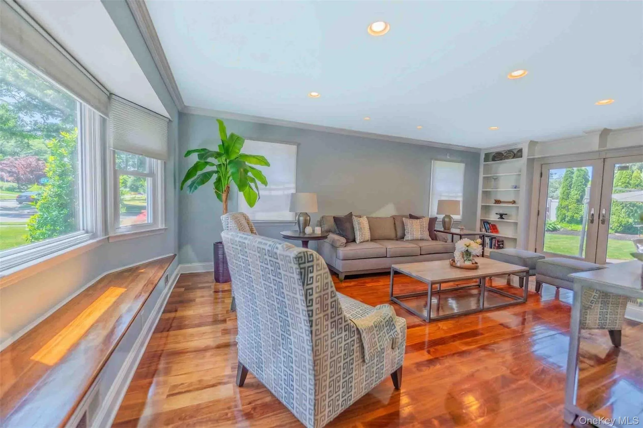 Sun-drenched den with gorgeous hardwood floors, modern recessed lighting, and seamless backyard access. Sun-drenched den with gorgeous hardwood floors, modern recessed lighting, and seamless backyard access.