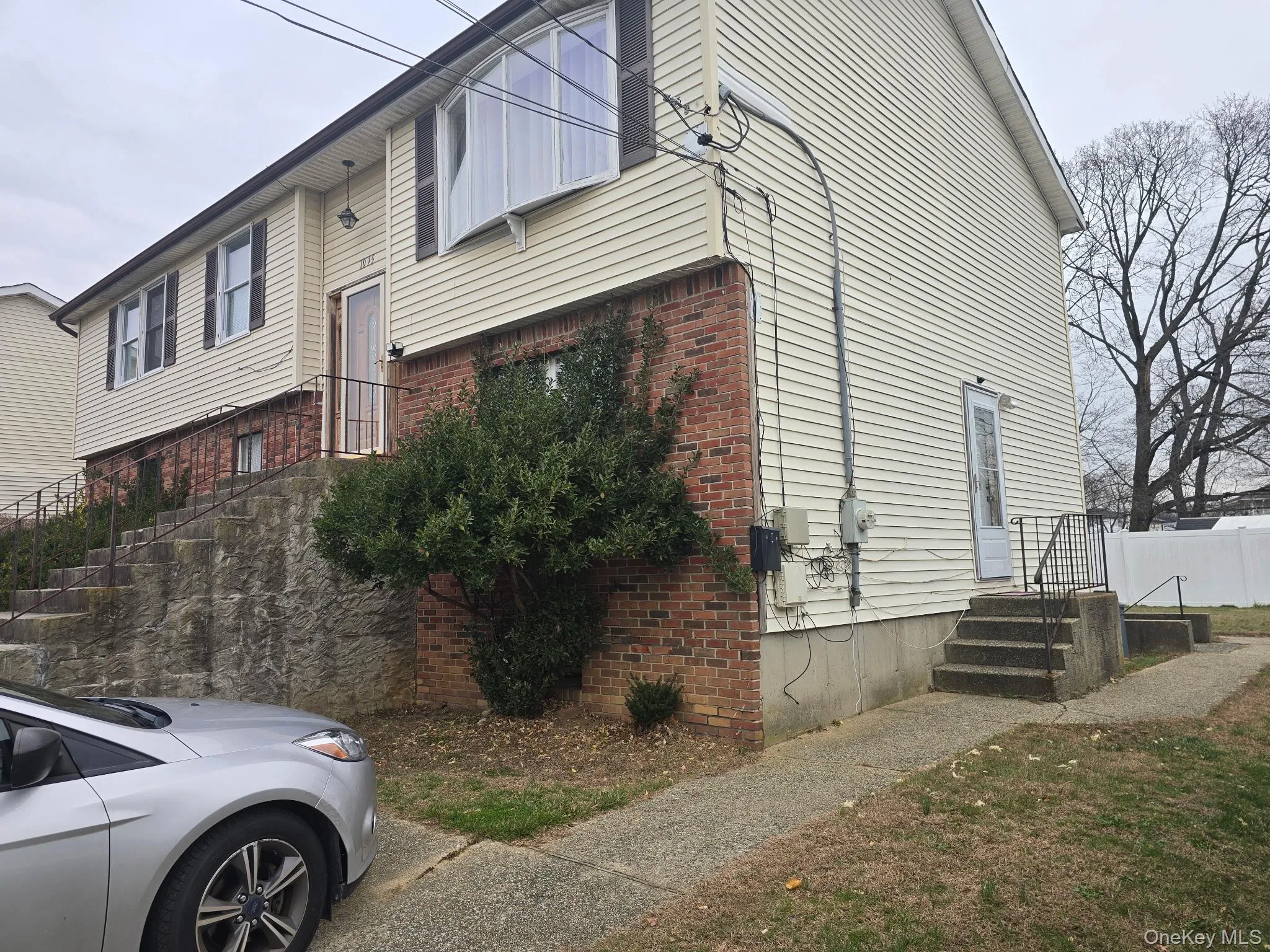 View of side of property featuring brick siding View of side of property featuring brick siding