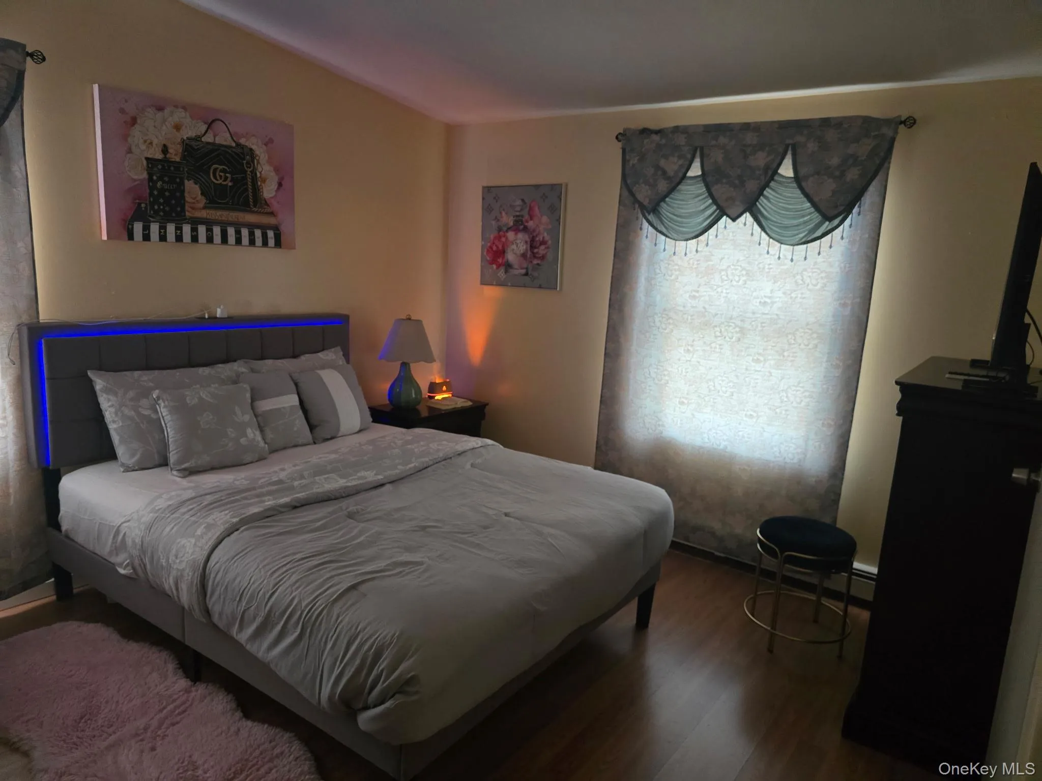Bedroom with wood finished floors Bedroom with wood finished floors