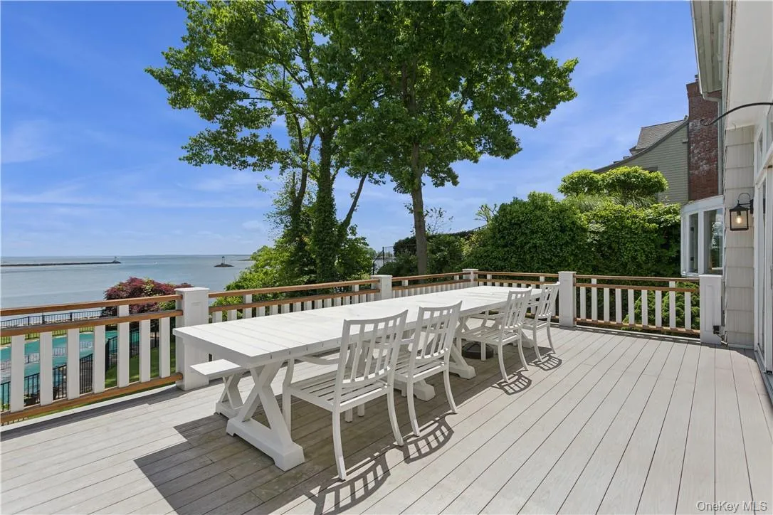 Spacious open deck overlooking back property and water Spacious open deck overlooking back property and water