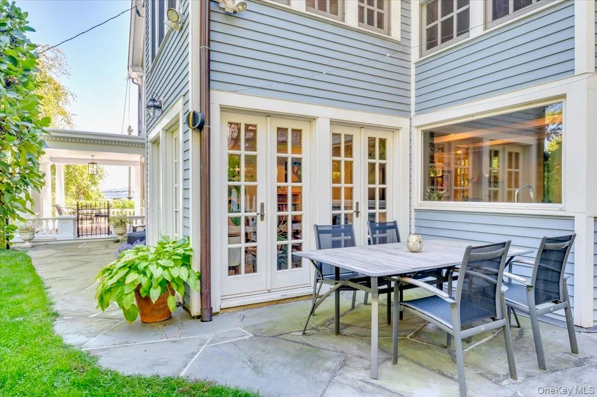 View of patio featuring french doors and outdoor dining space View of patio featuring french doors and outdoor dining space