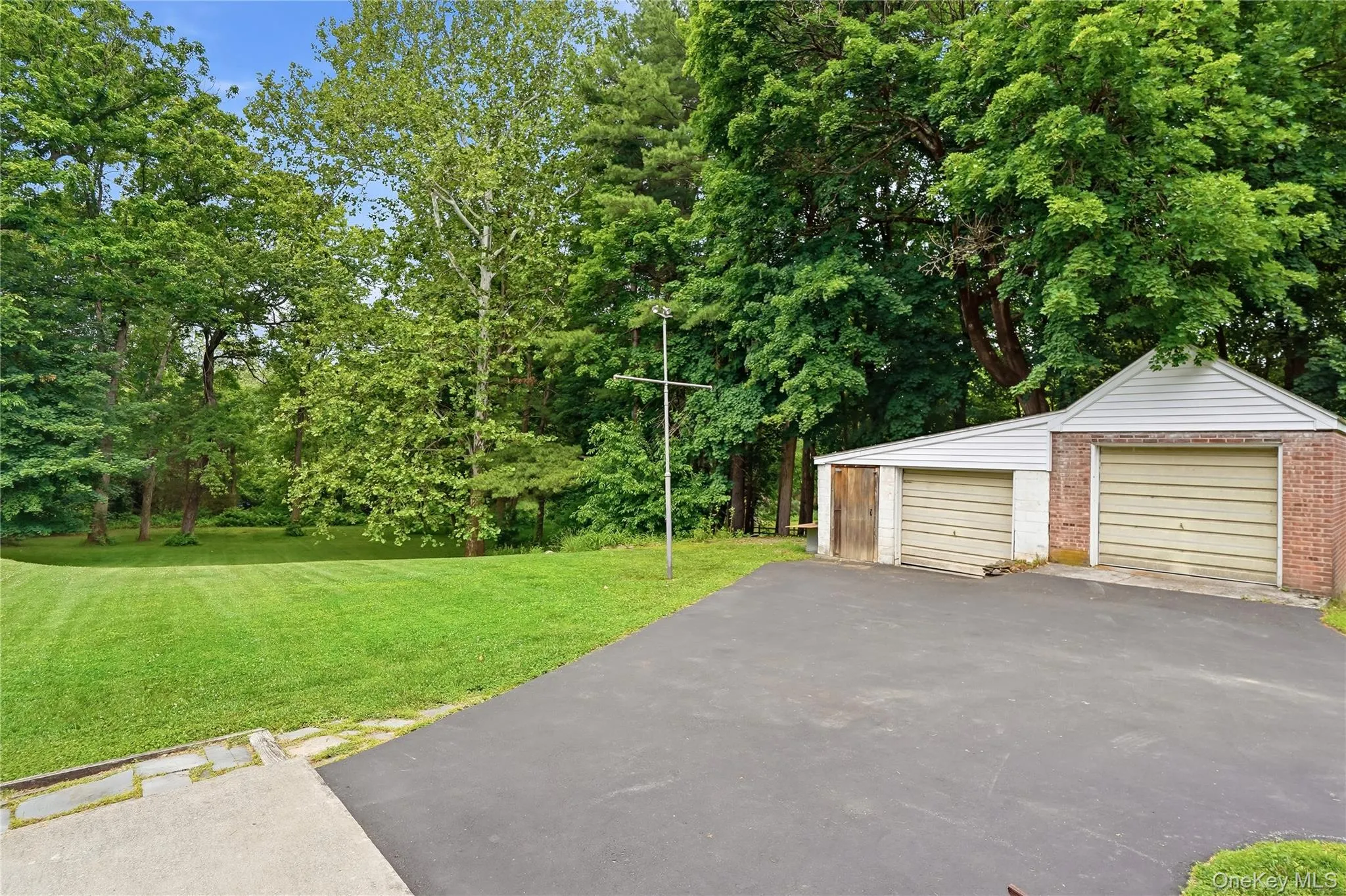 2 car detached garage. Driveway sealed 2025. 2 car detached garage. Driveway sealed 2025.