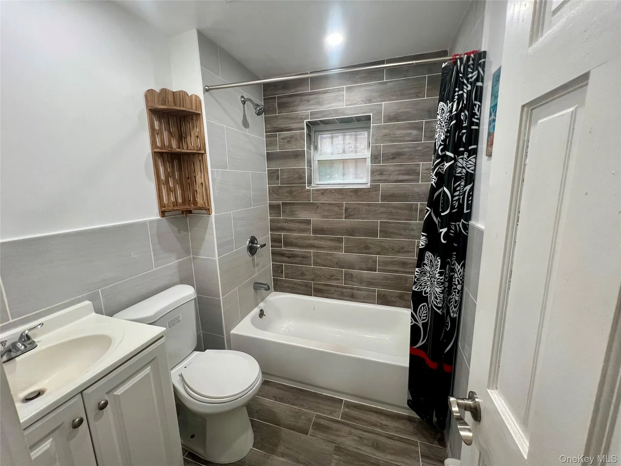 Full bathroom with vanity, shower / bath combination Full bathroom with vanity, shower / bath combination