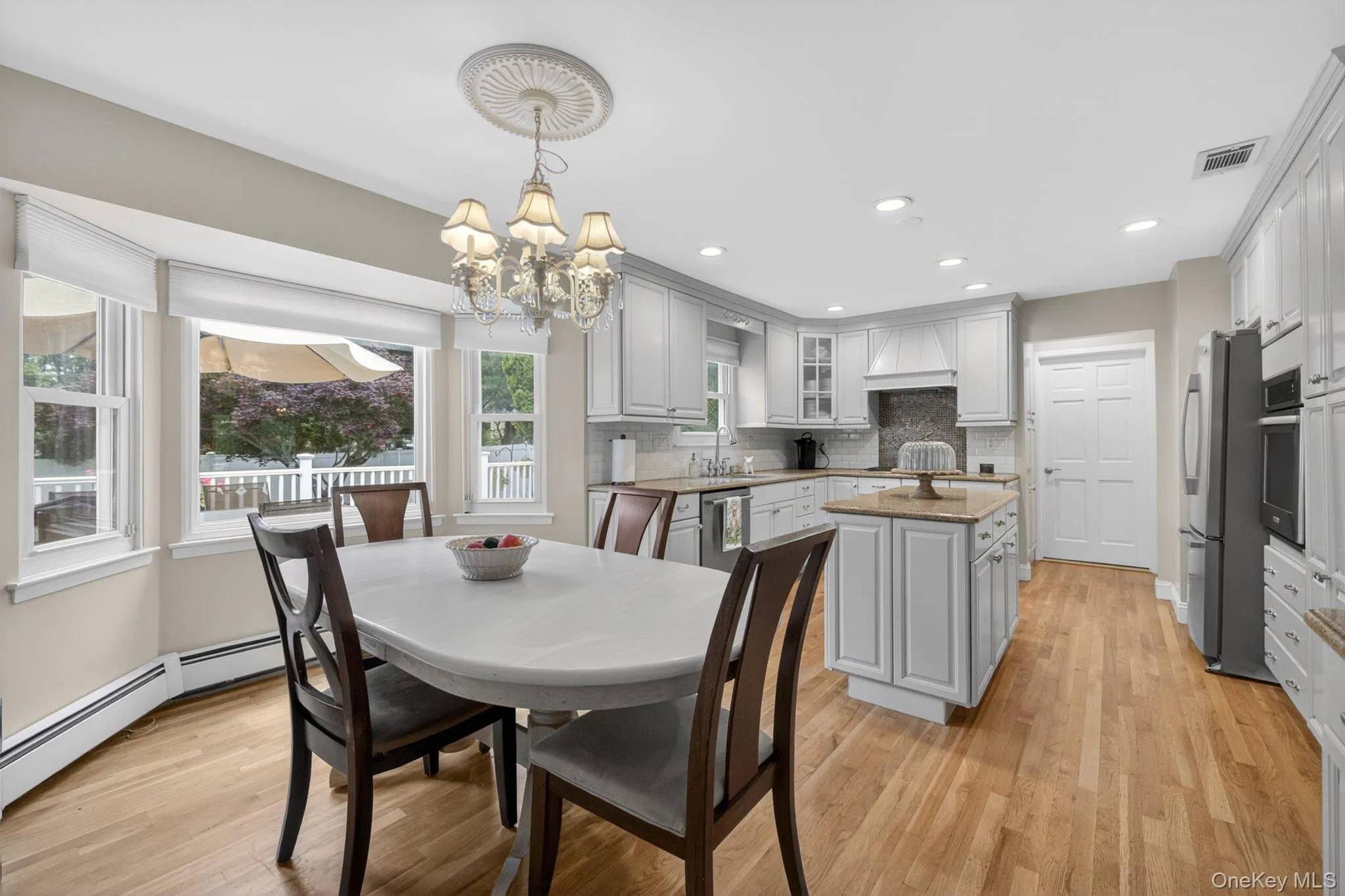 Eat-in Kitchen with bow window and stainless steel appliances. Eat-in Kitchen with bow window and stainless steel appliances.