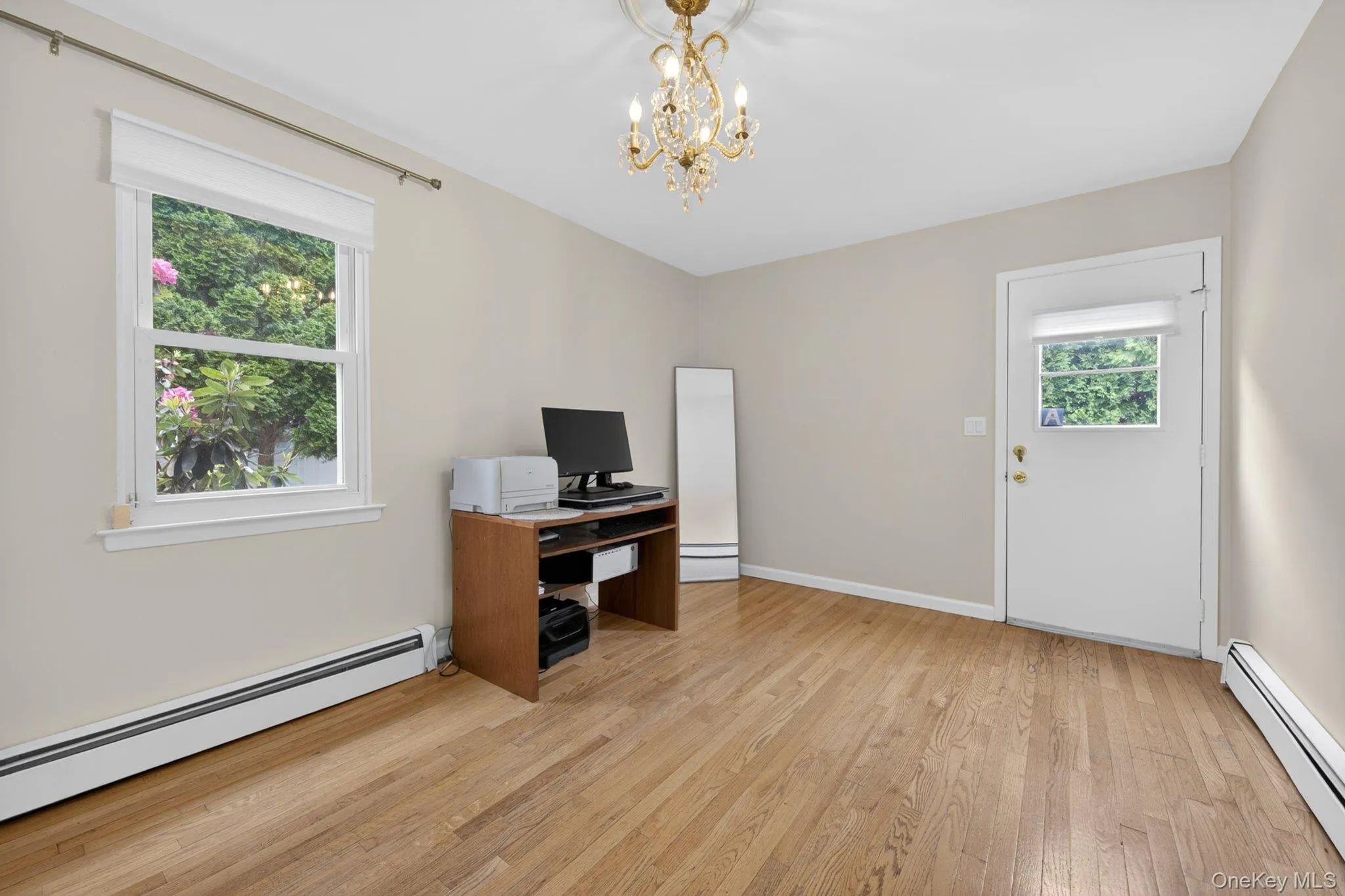Office with door out to side yard. Office with door out to side yard.