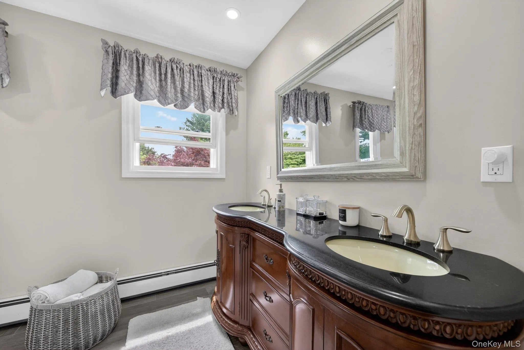 En-suite bathroom with dual sinks. En-suite bathroom with dual sinks.