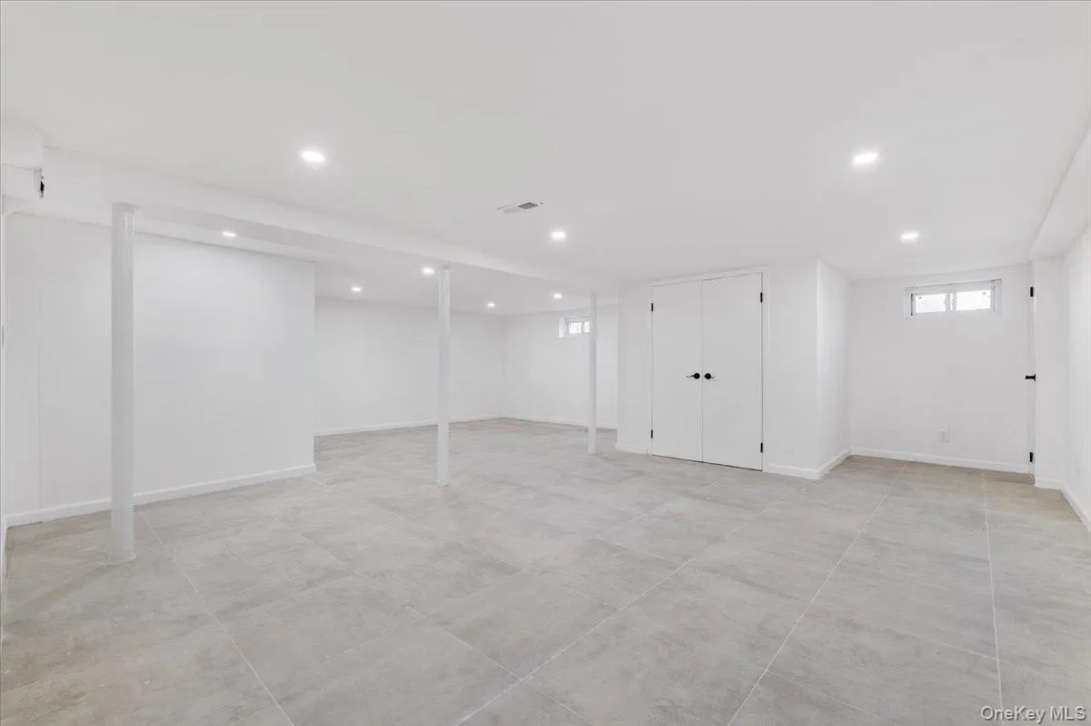 Basement featuring recessed lighting and baseboards Basement featuring recessed lighting and baseboards