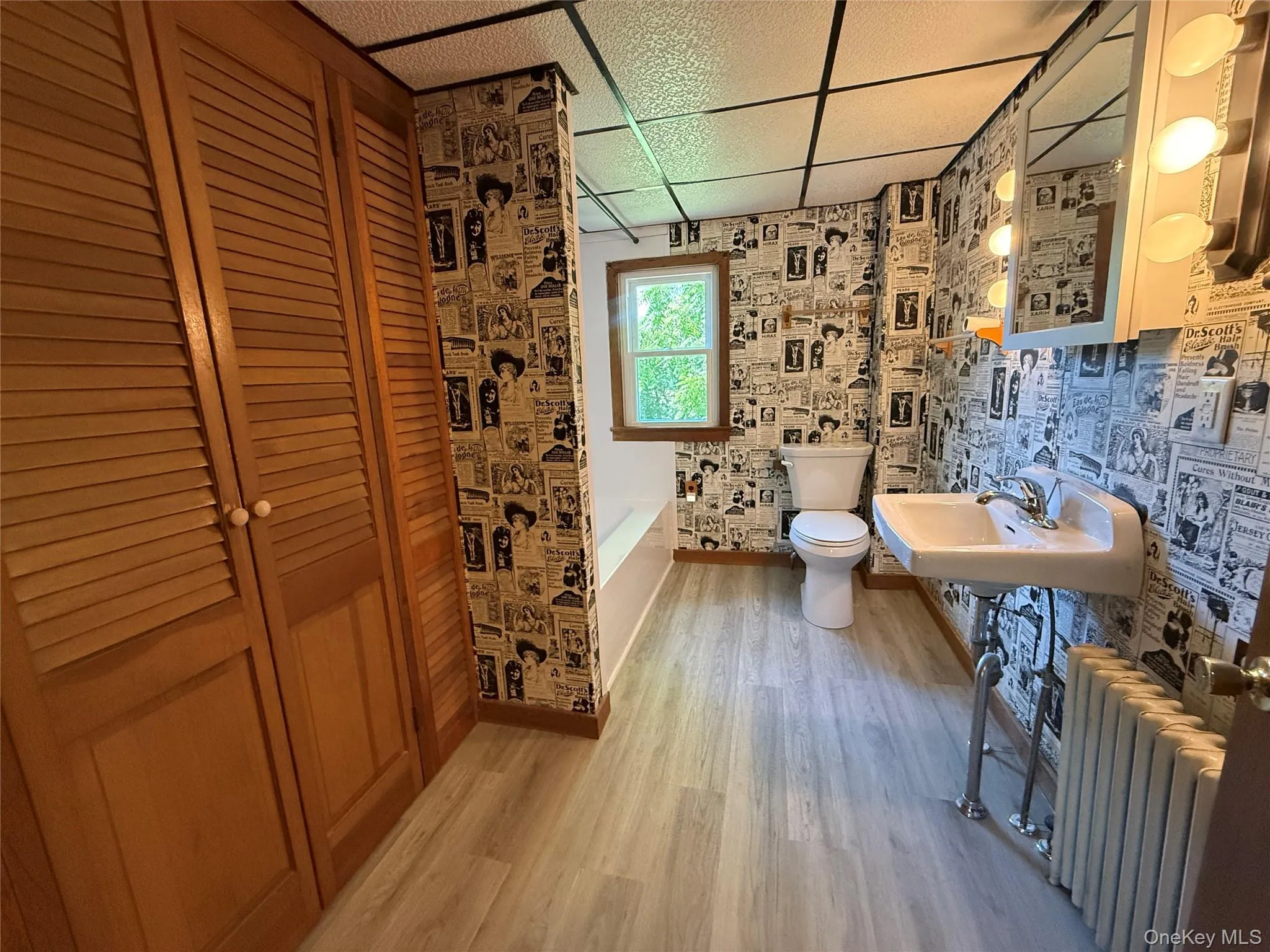 Bathroom with large linen closet and bathtub Bathroom with large linen closet and bathtub