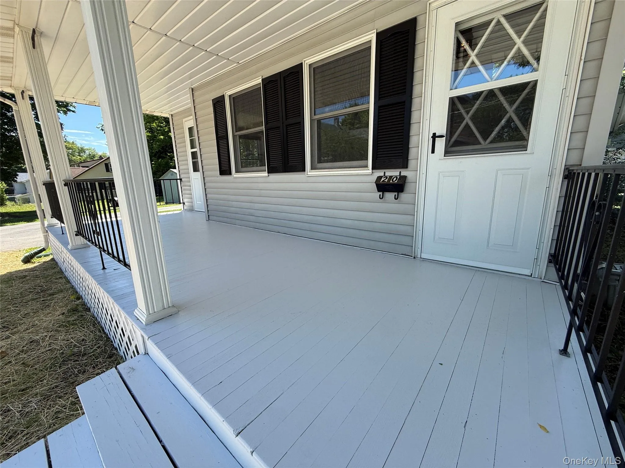 View of front porch with newly stained floor View of front porch with newly stained floor