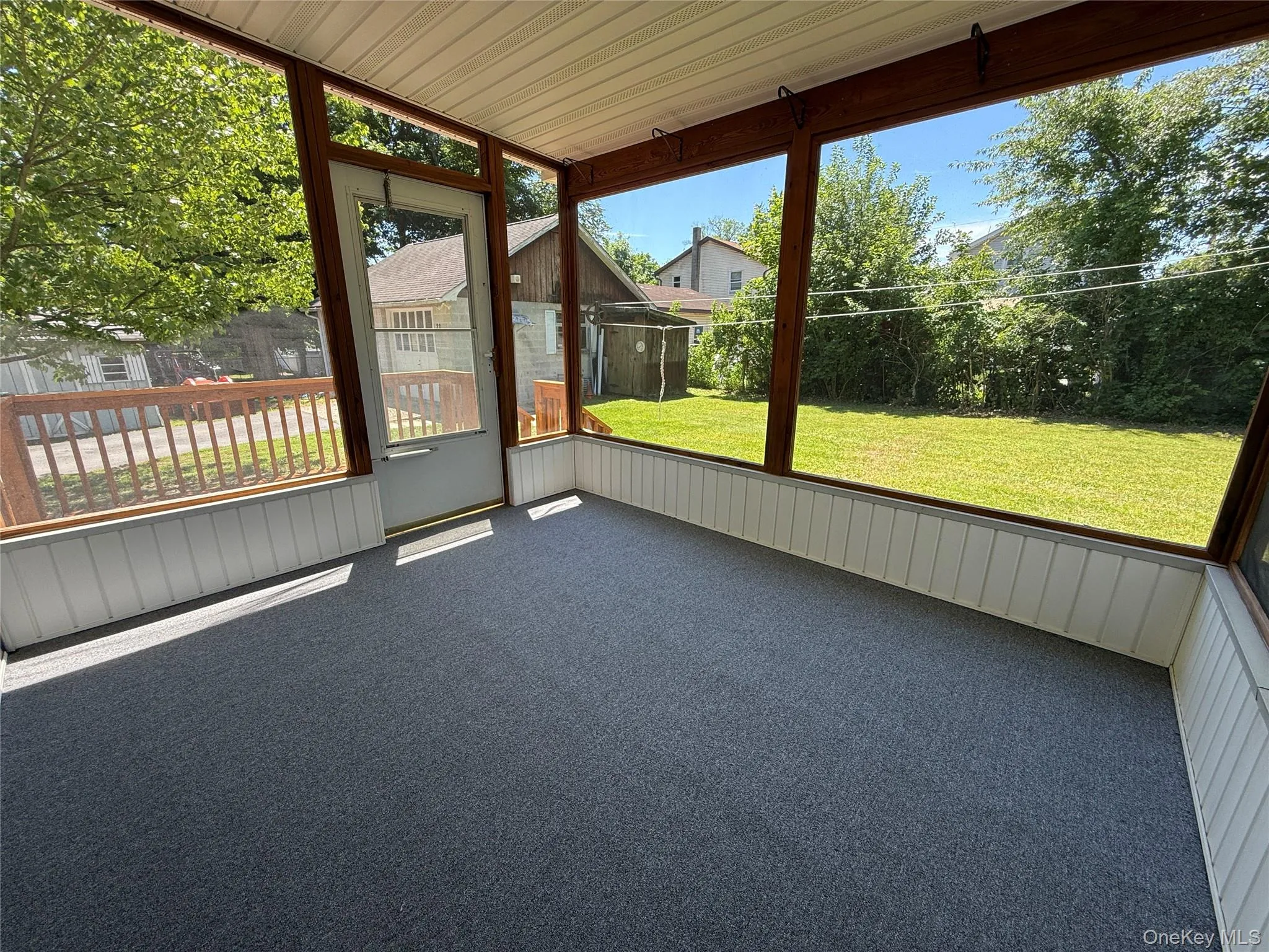 Screened in back porch overlooking the backyard Screened in back porch overlooking the backyard