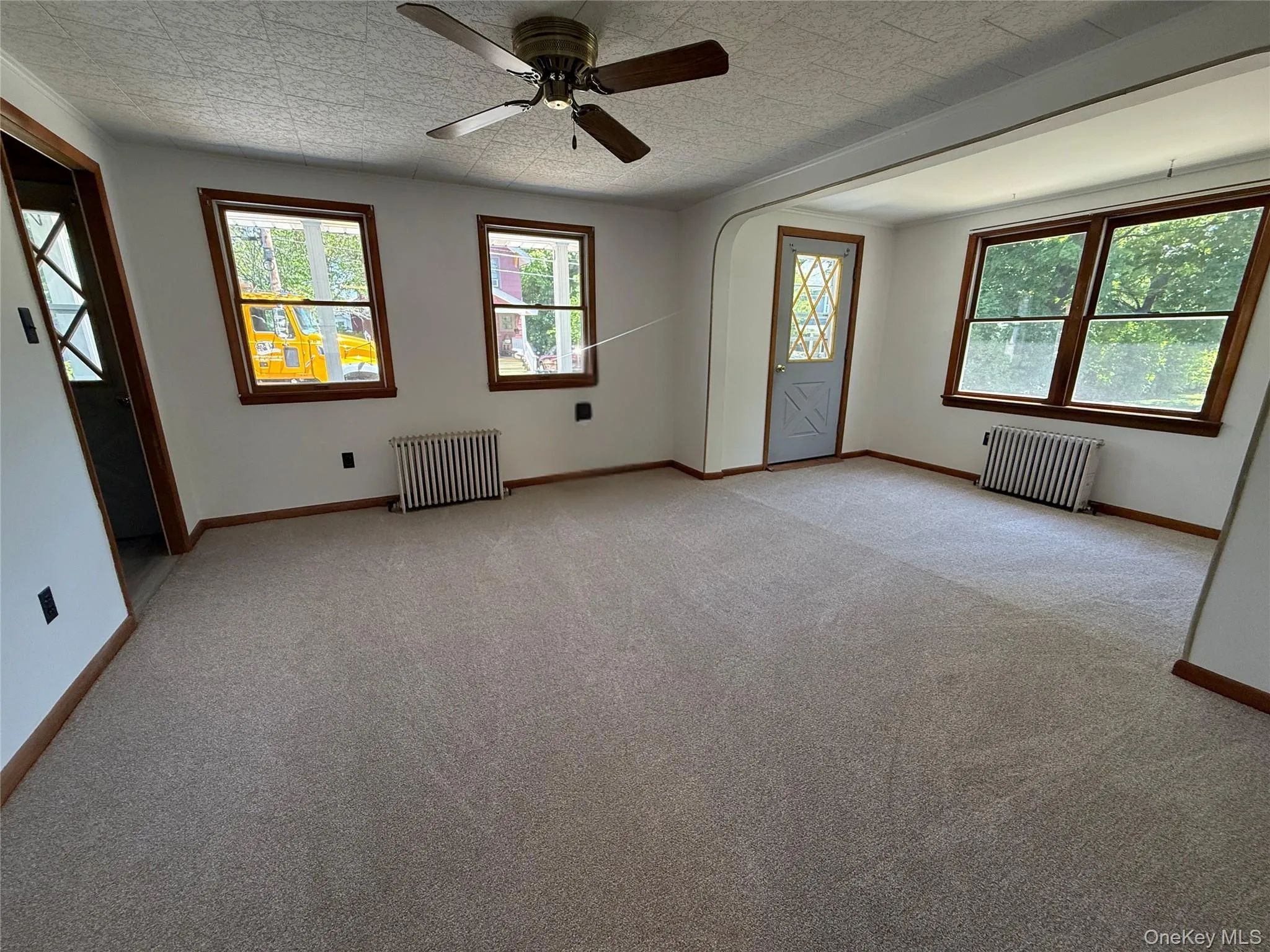 View of living room with lots of light, freshly painted and new carpeting View of living room with lots of light, freshly painted and new carpeting