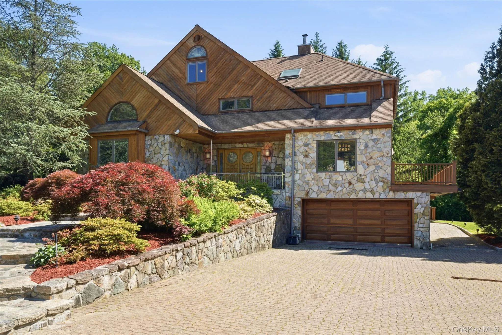 Grand Arrival: Beautifully manicured grounds and an elegant paver driveway welcome you home. Grand Arrival: Beautifully manicured grounds and an elegant paver driveway welcome you home.
