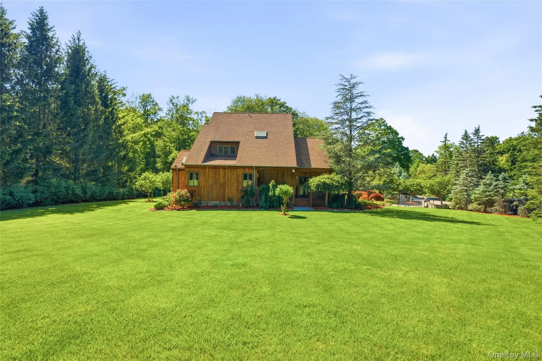 Expansive Backyard: A sprawling, level lawn offering endless space for recreation, entertaining, and outdoor enjoyment. Expansive Backyard: A sprawling, level lawn offering endless space for recreation, entertaining, and outdoor enjoyment.
