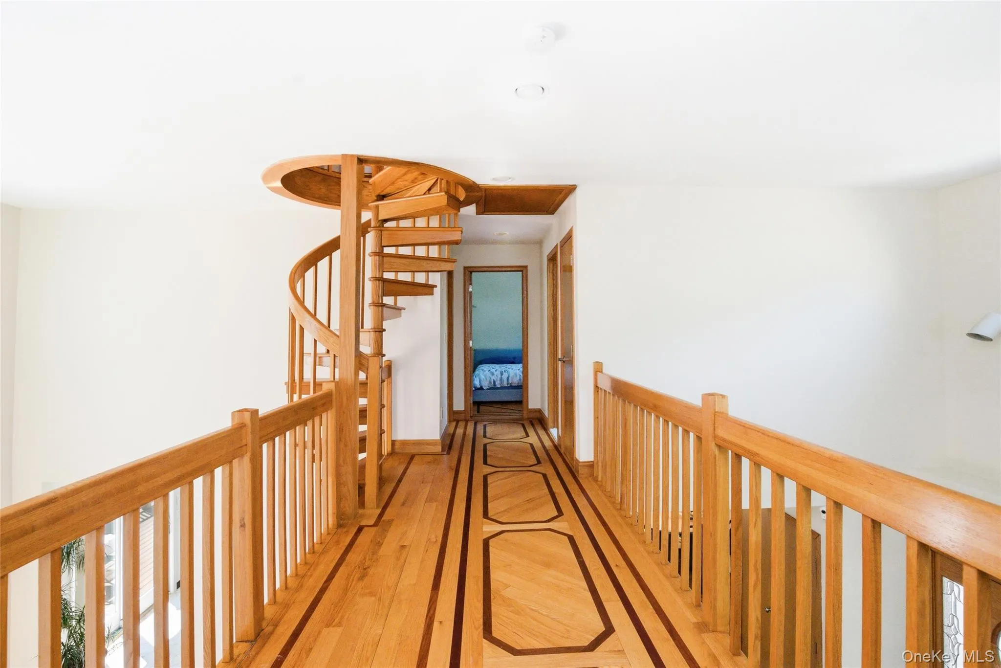 Architectural upper-level catwalk creating a striking connection between living spaces while enhancing the home's open and airy feel. Architectural upper-level catwalk creating a striking connection between living spaces while enhancing the home's open and airy feel.