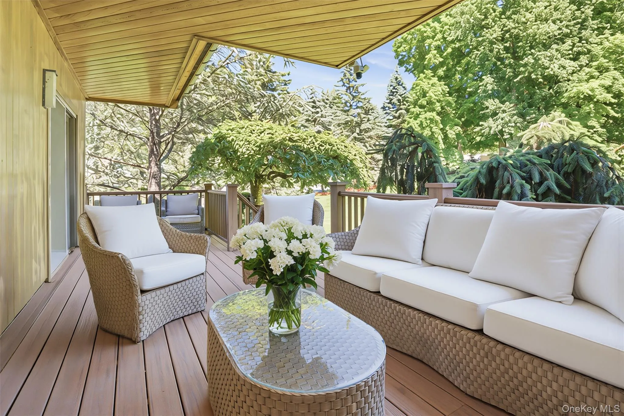 Private Primary Suite Deck: A secluded outdoor retreat surrounded by mature landscaping, perfect for morning coffee or unwinding in complete privacy. Private Primary Suite Deck: A secluded outdoor retreat surrounded by mature landscaping, perfect for morning coffee or unwinding in complete privacy.