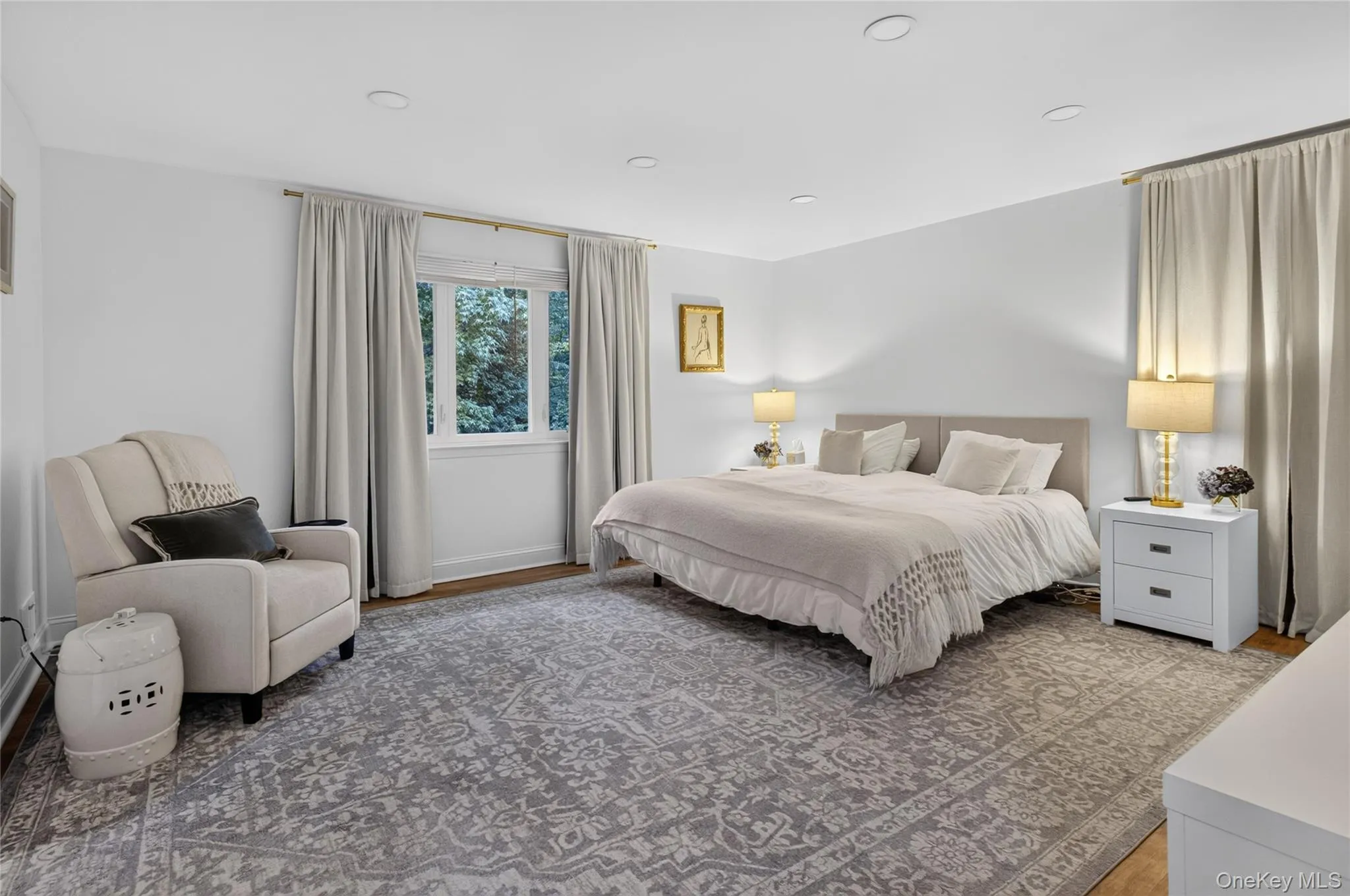 Spacious zen-like bedroom featuring recessed lighting, and dual exposure. Spacious zen-like bedroom featuring recessed lighting, and dual exposure.