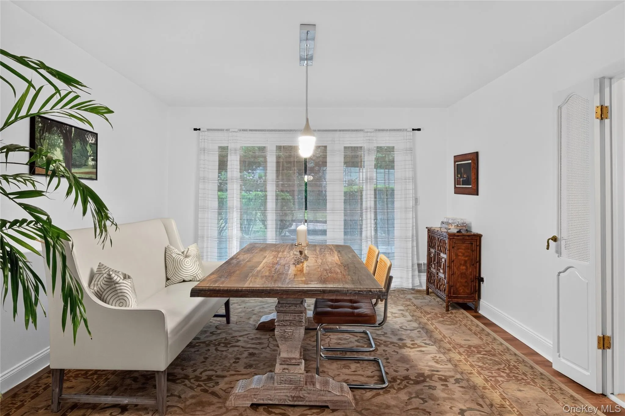 Large dining room with sliding glass doors to rear patio. Large dining room with sliding glass doors to rear patio.