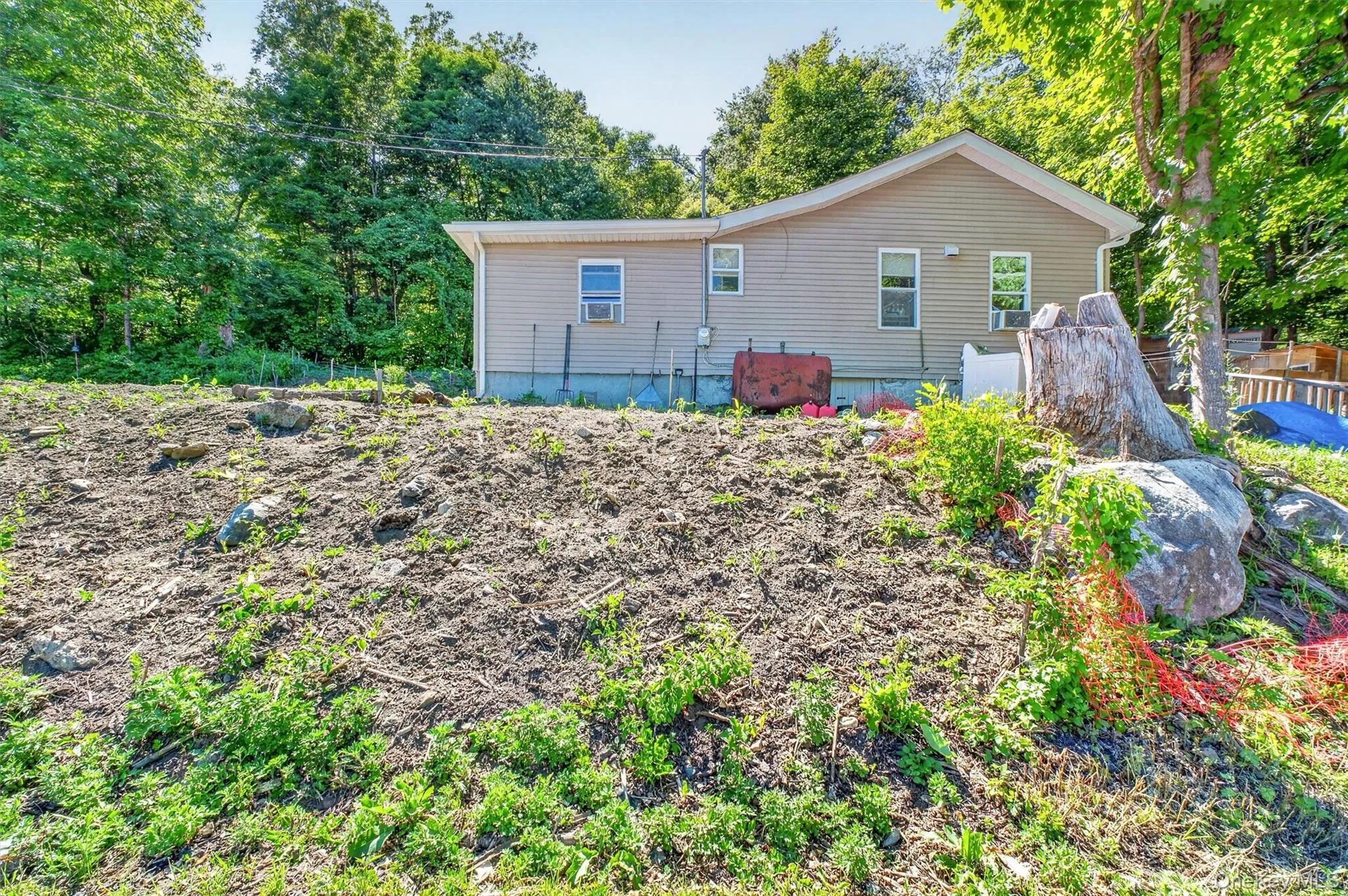 The house is set back at the end of a long driveway. The house is set back at the end of a long driveway.