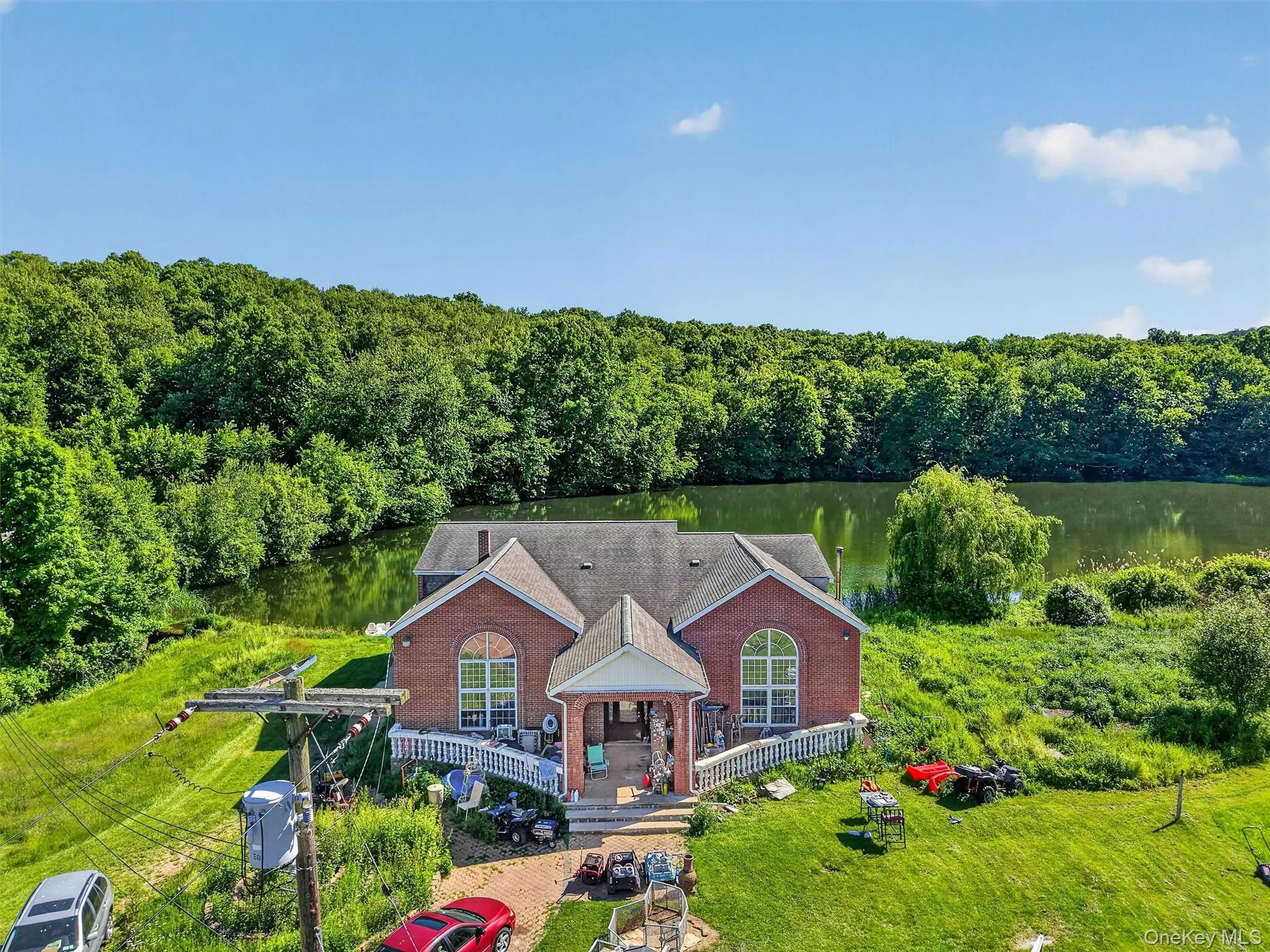 This lakefront home features 6 bedrooms, 4 bathrooms, and direct access to the private lake, complete with its own boat dock. This lakefront home features 6 bedrooms, 4 bathrooms, and direct access to the private lake, complete with its own boat dock.