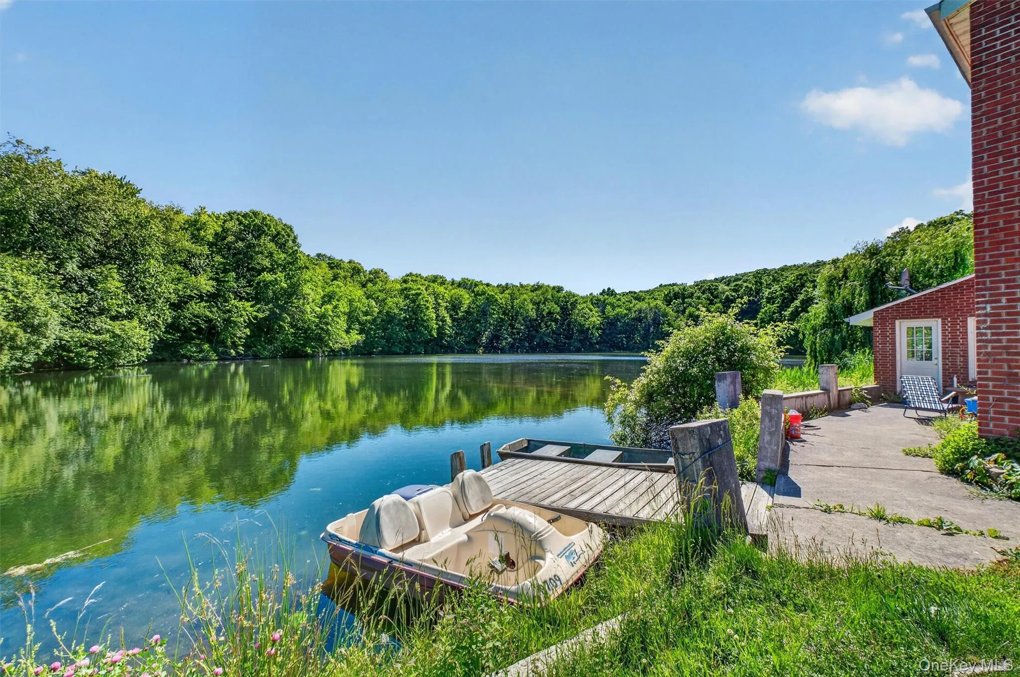 Enjoy picturesque lake views and direct water access from the home's convenient private dock. Enjoy picturesque lake views and direct water access from the home's convenient private dock.