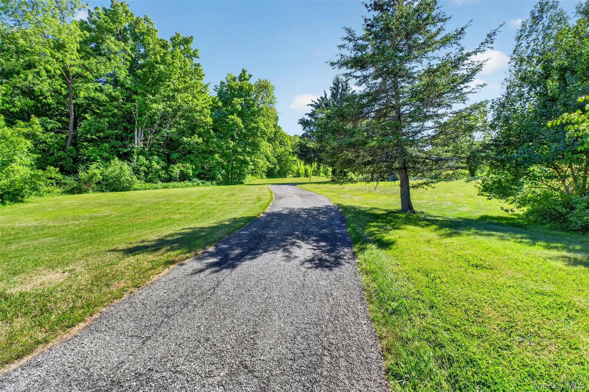 Approach the home via a picturesque driveway framed by meticulously maintained grounds. Approach the home via a picturesque driveway framed by meticulously maintained grounds.