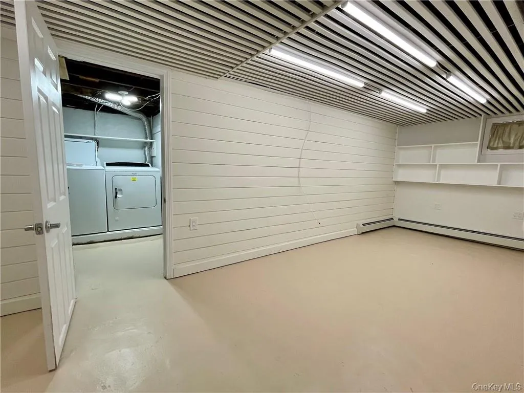 Basement featuring private use of the washer, dryer, and sink in the laundry room Basement featuring private use of the washer, dryer, and sink in the laundry room