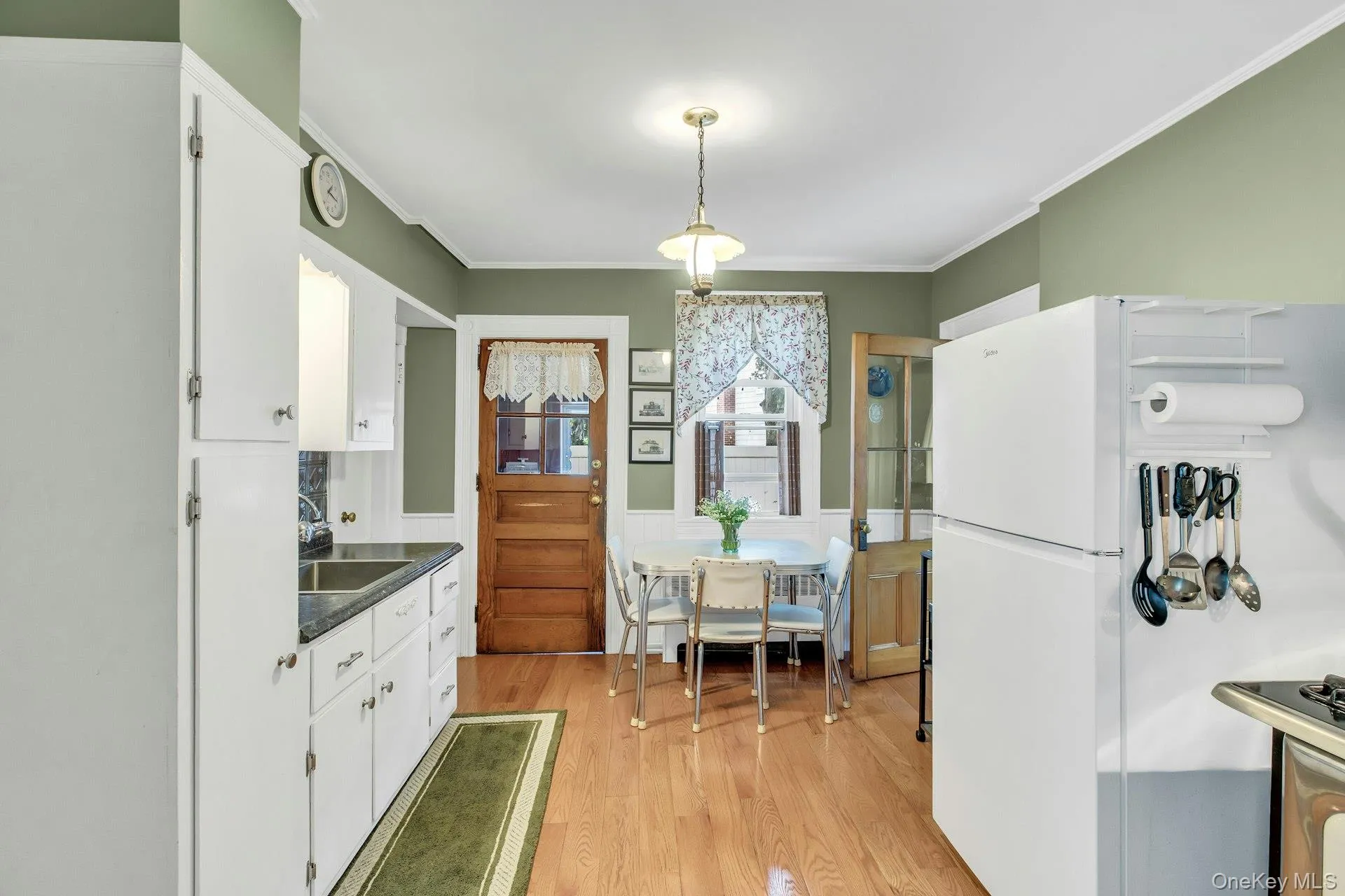 Eat in kitchen opens to laundry room with door to backyard Eat in kitchen opens to laundry room with door to backyard