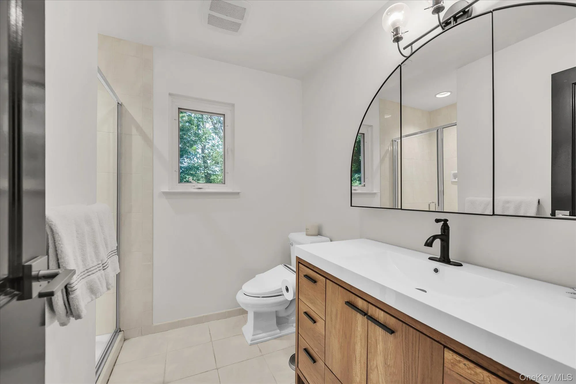 The primary suite offers a renovated spa-like bath The primary suite offers a renovated spa-like bath