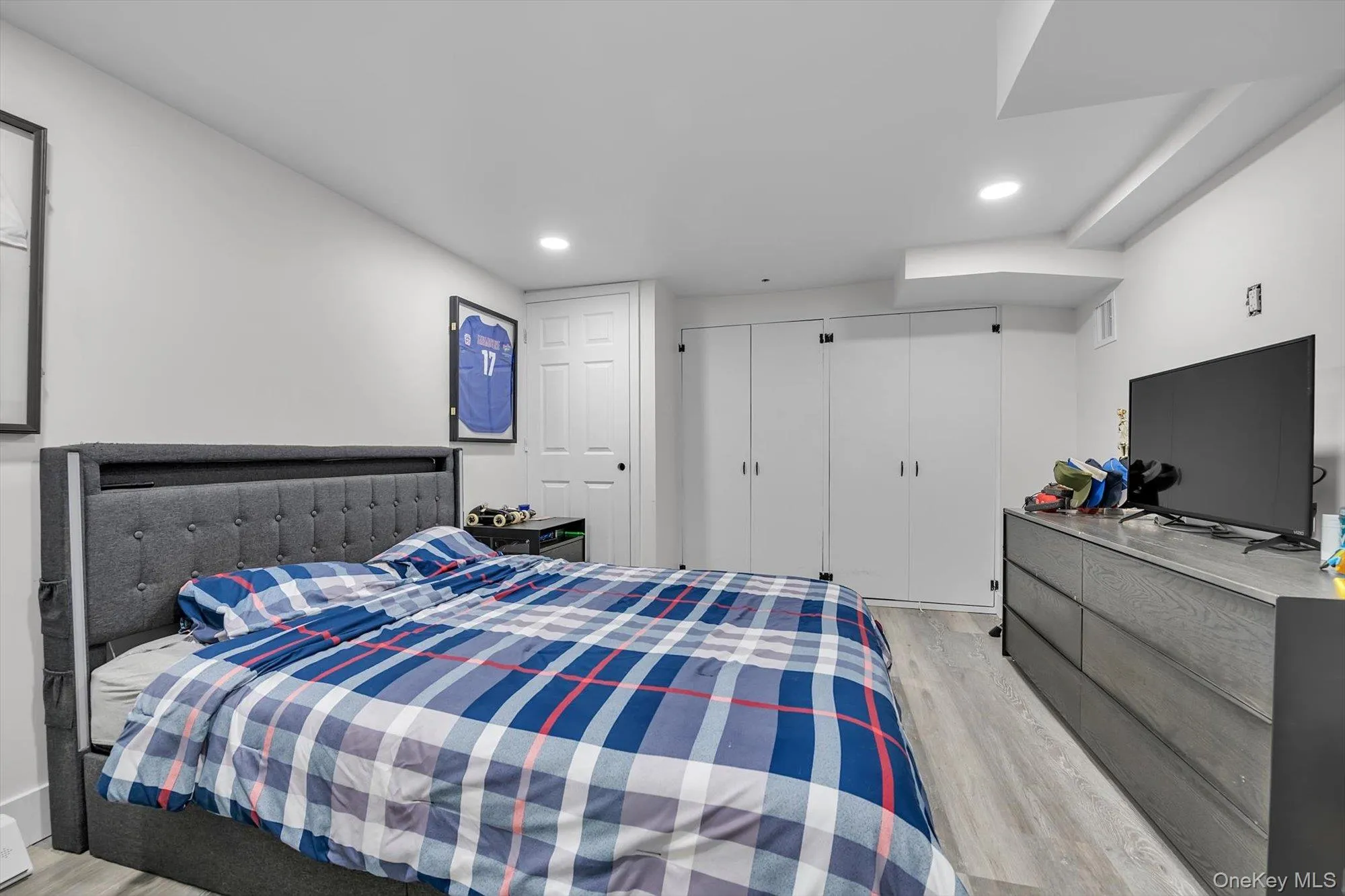 Light-toned wood-finish flooring complements white walls Light-toned wood-finish flooring complements white walls