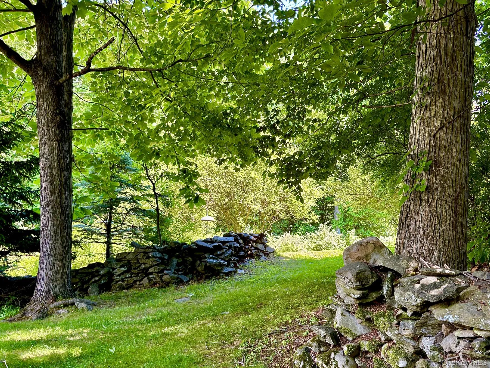 Stone walls, lawns, large trees Stone walls, lawns, large trees