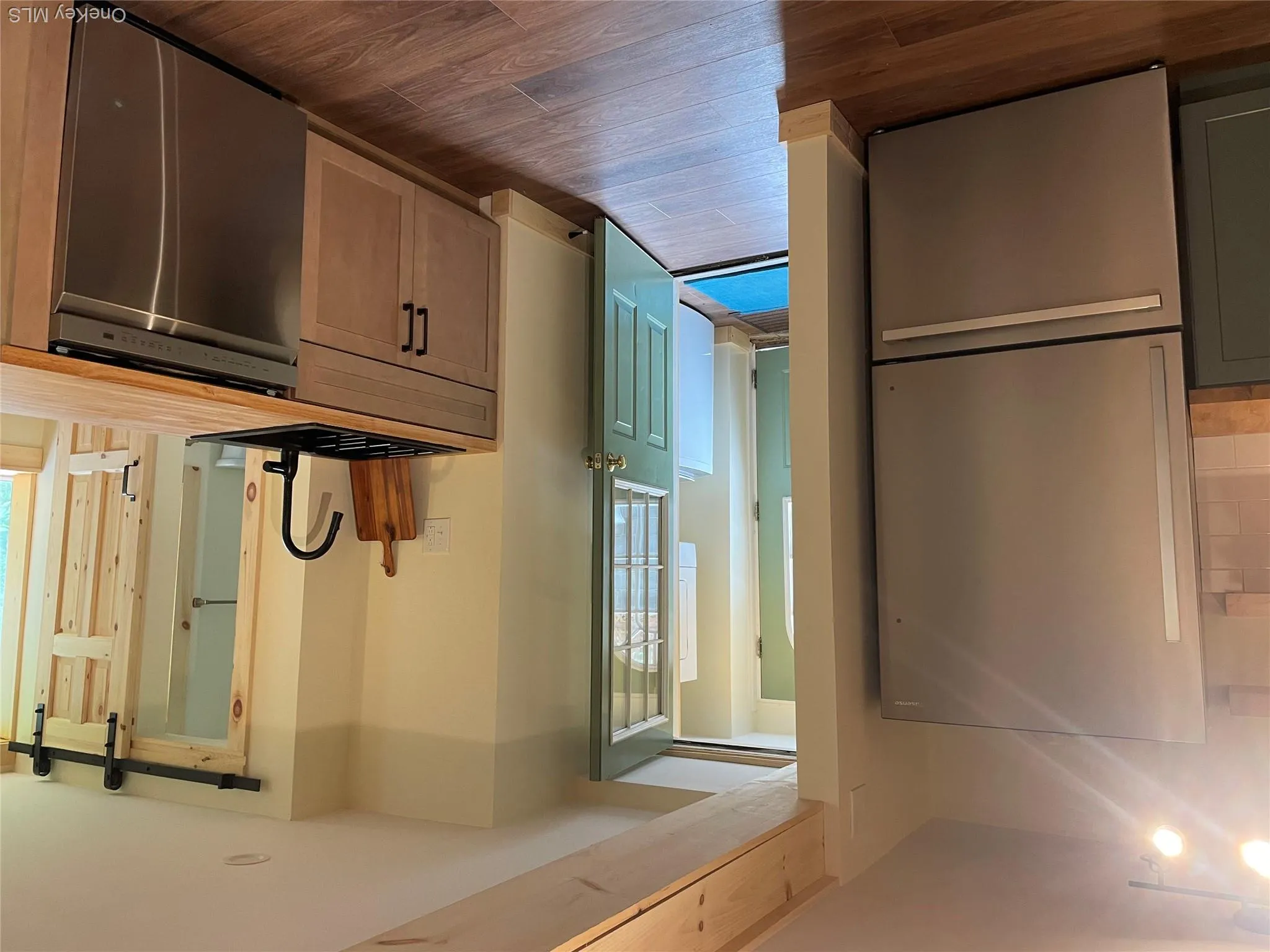 Entrance off kitchen to storage/laundry/mud room. Entrance off kitchen to storage/laundry/mud room.