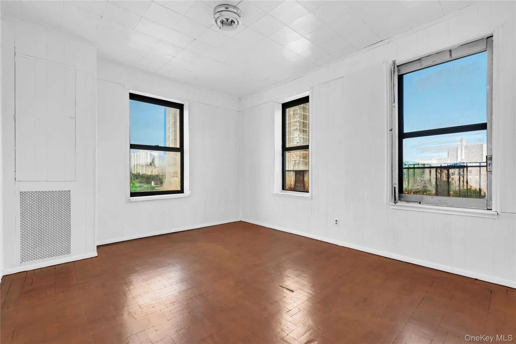 Spare room with parquet floors and crown molding Spare room with parquet floors and crown molding