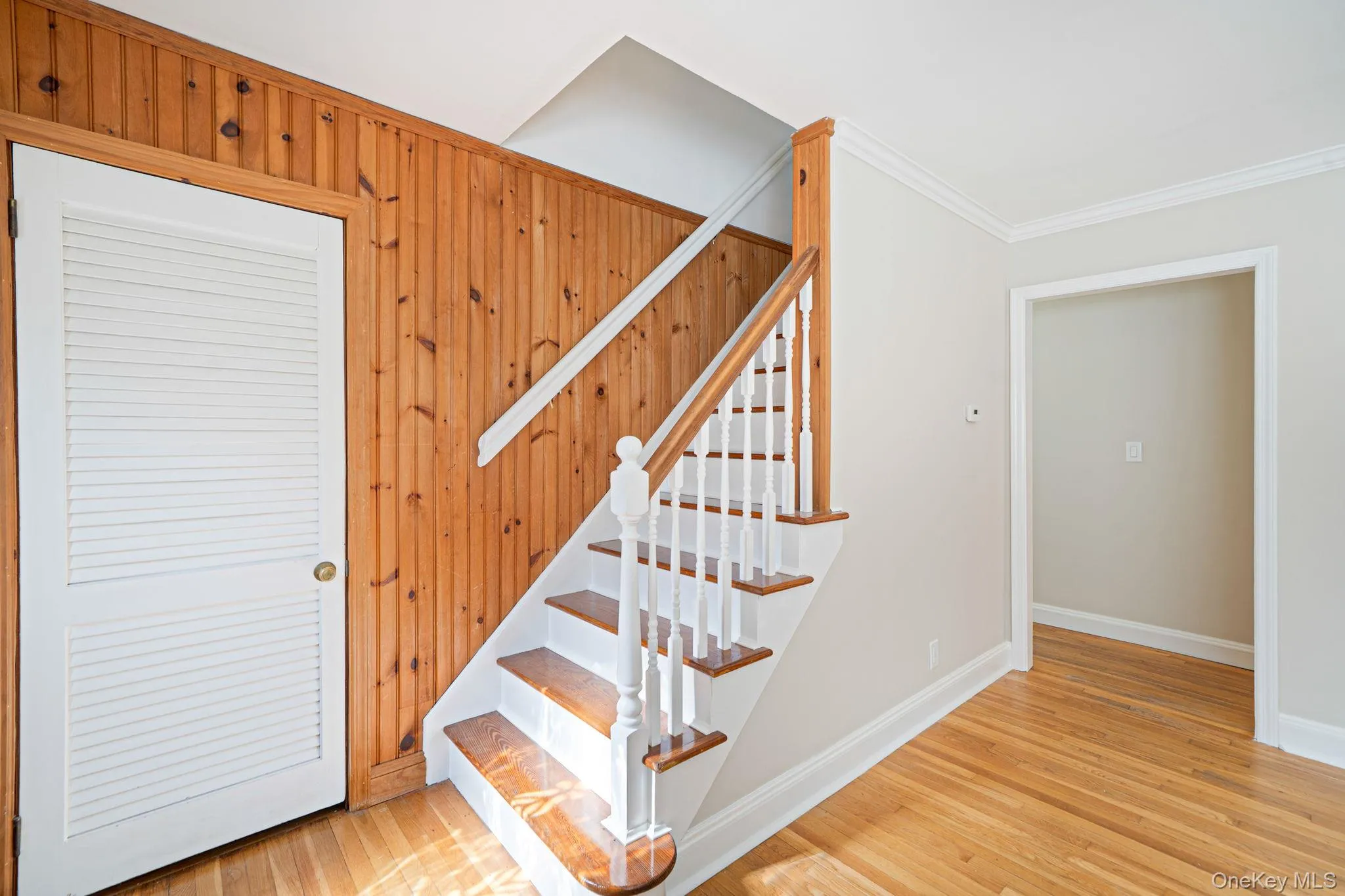 Staircase to second level, coat closet in entry Staircase to second level, coat closet in entry