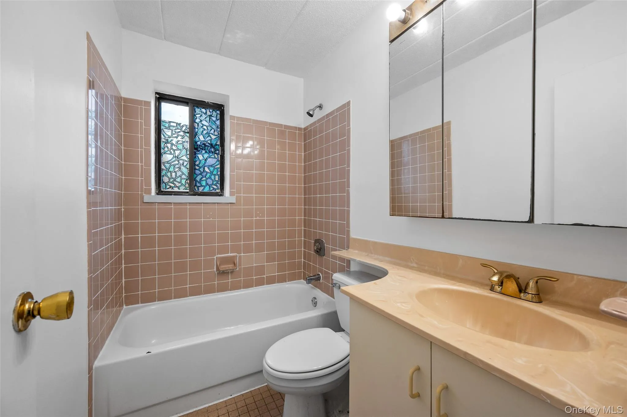 A bathroom with window. A bathroom with window.