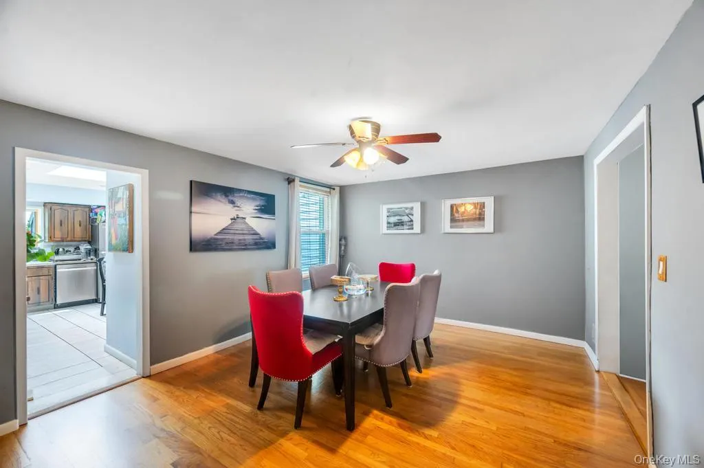 Hardwood flooring throughout the dining area with neutral wall tones Hardwood flooring throughout the dining area with neutral wall tones