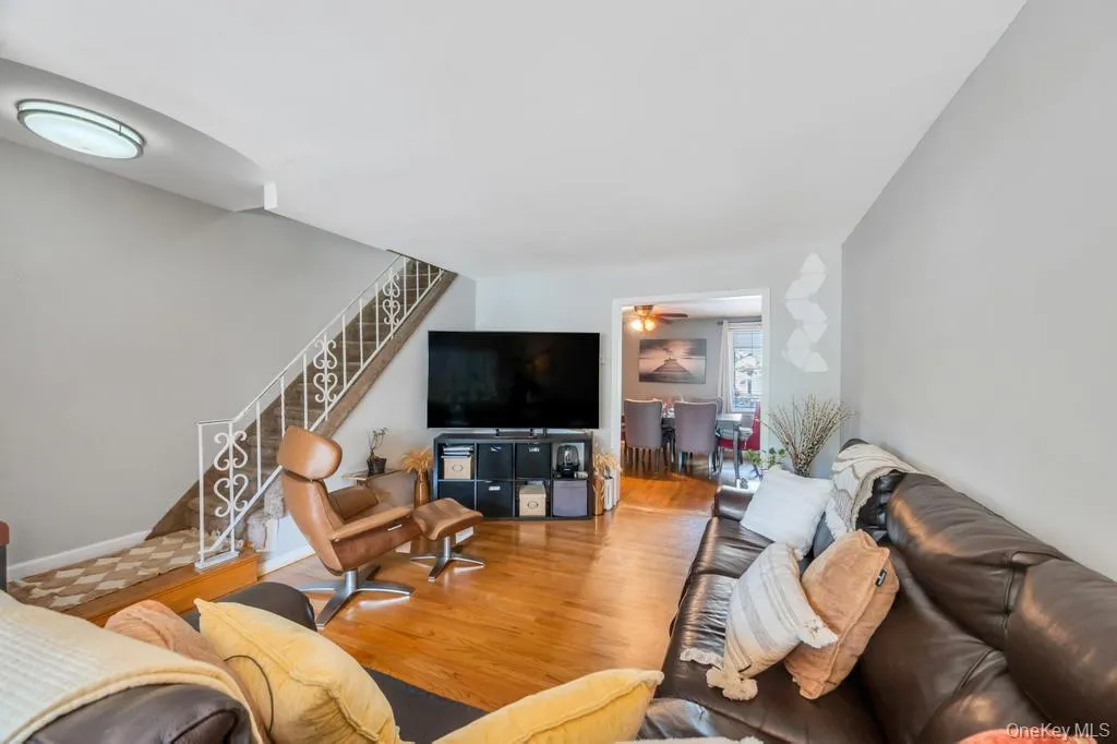 Hardwood flooring throughout the main living space with light gray wall tones and white trim Hardwood flooring throughout the main living space with light gray wall tones and white trim