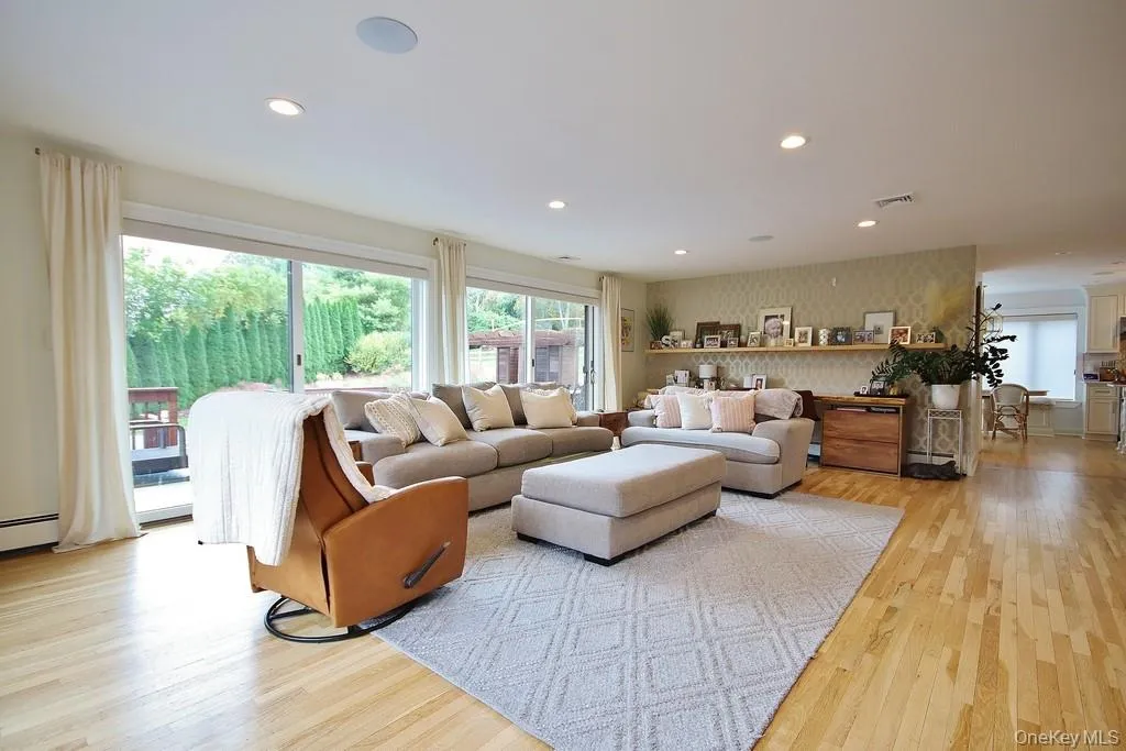 Family Room with Sliders to Deck & Flows into Kitchen Family Room with Sliders to Deck & Flows into Kitchen