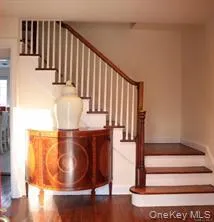 Graceful staircase in center hall Graceful staircase in center hall