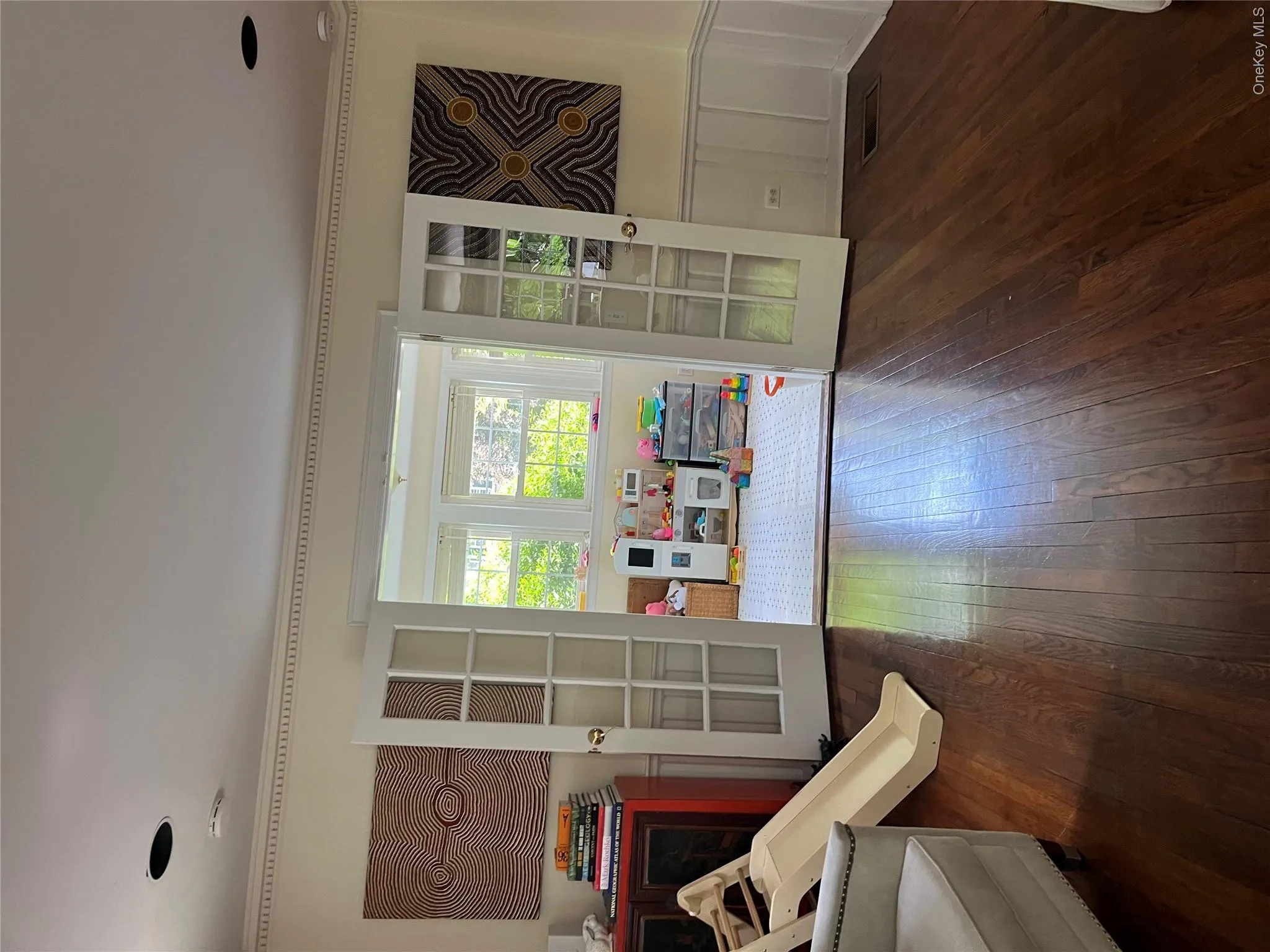 Sunroom through French doors off living room Sunroom through French doors off living room