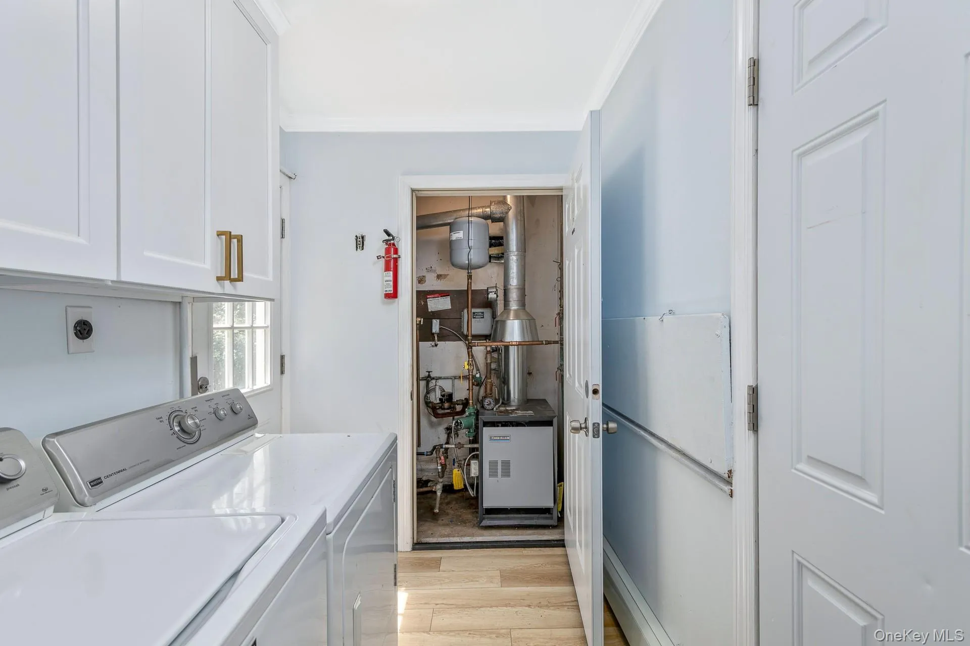 Laundry center and boiler room, right off the kitchen. Brand new water tank. Laundry center and boiler room, right off the kitchen. Brand new water tank.
