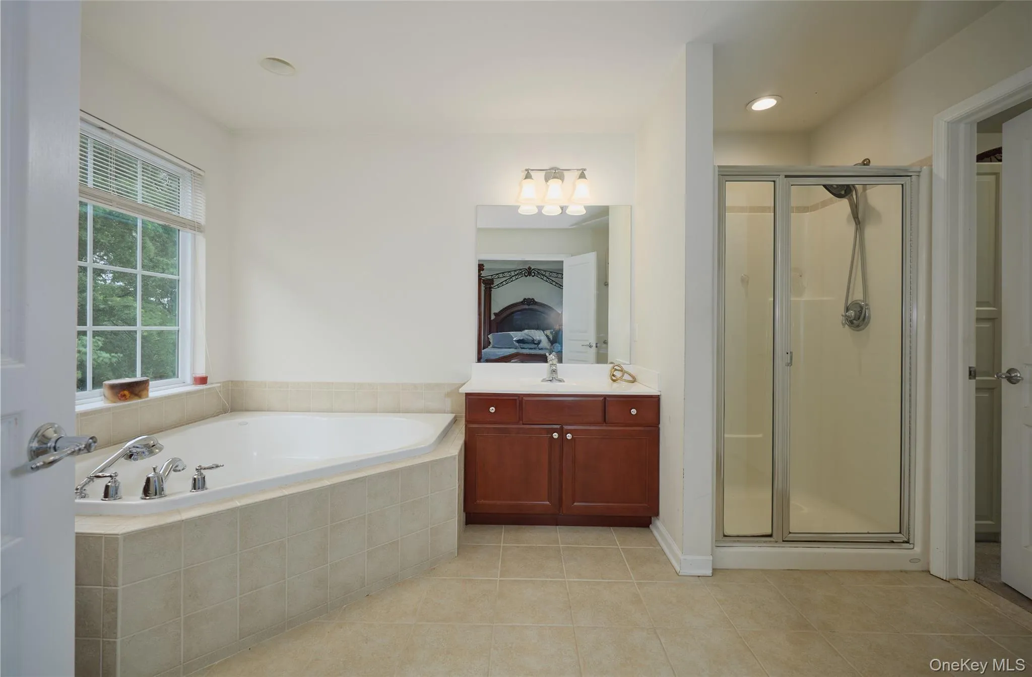 Tile floor, walk-in shower, large tub Tile floor, walk-in shower, large tub
