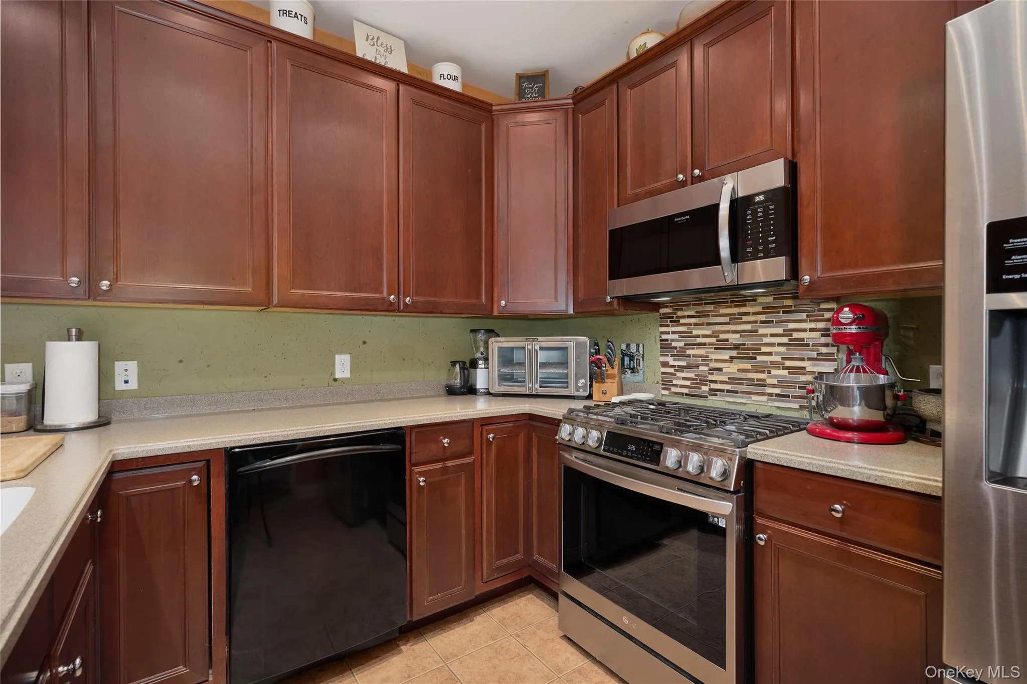 Recessed lighting, cherry cabinets, Corian countertops Recessed lighting, cherry cabinets, Corian countertops