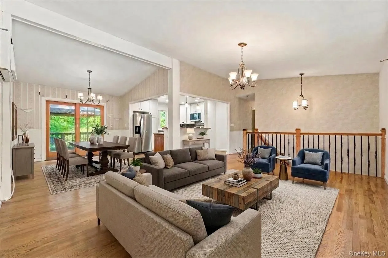 An open concept virtually staged living room and dining room An open concept virtually staged living room and dining room