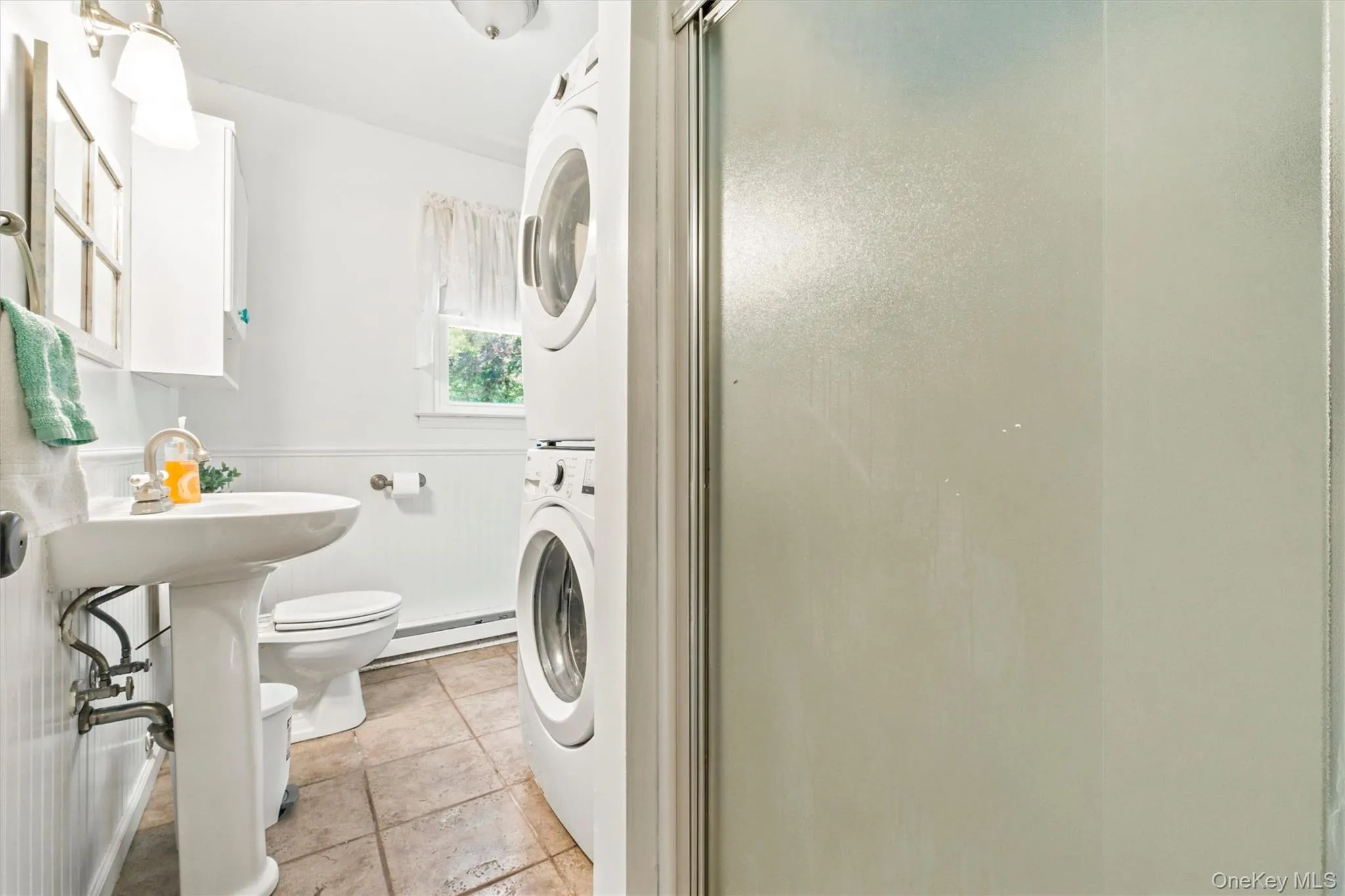 Lower level full bath with shower and laundry Lower level full bath with shower and laundry