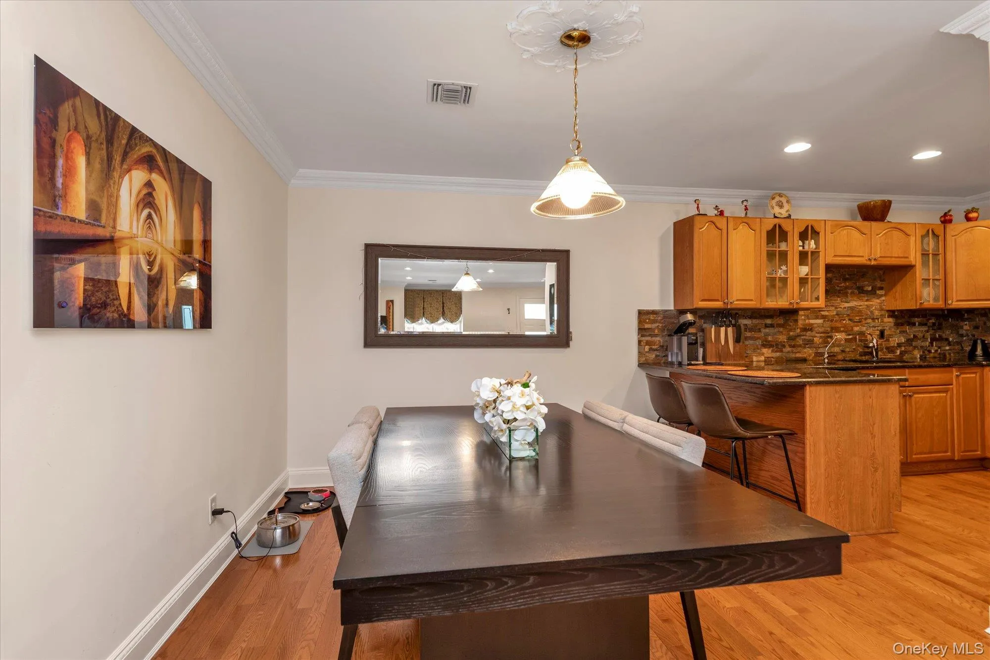 Open concept dining room leading to open kitchen with stainlees steel appliances and wsher dryer. Open concept dining room leading to open kitchen with stainlees steel appliances and wsher dryer.