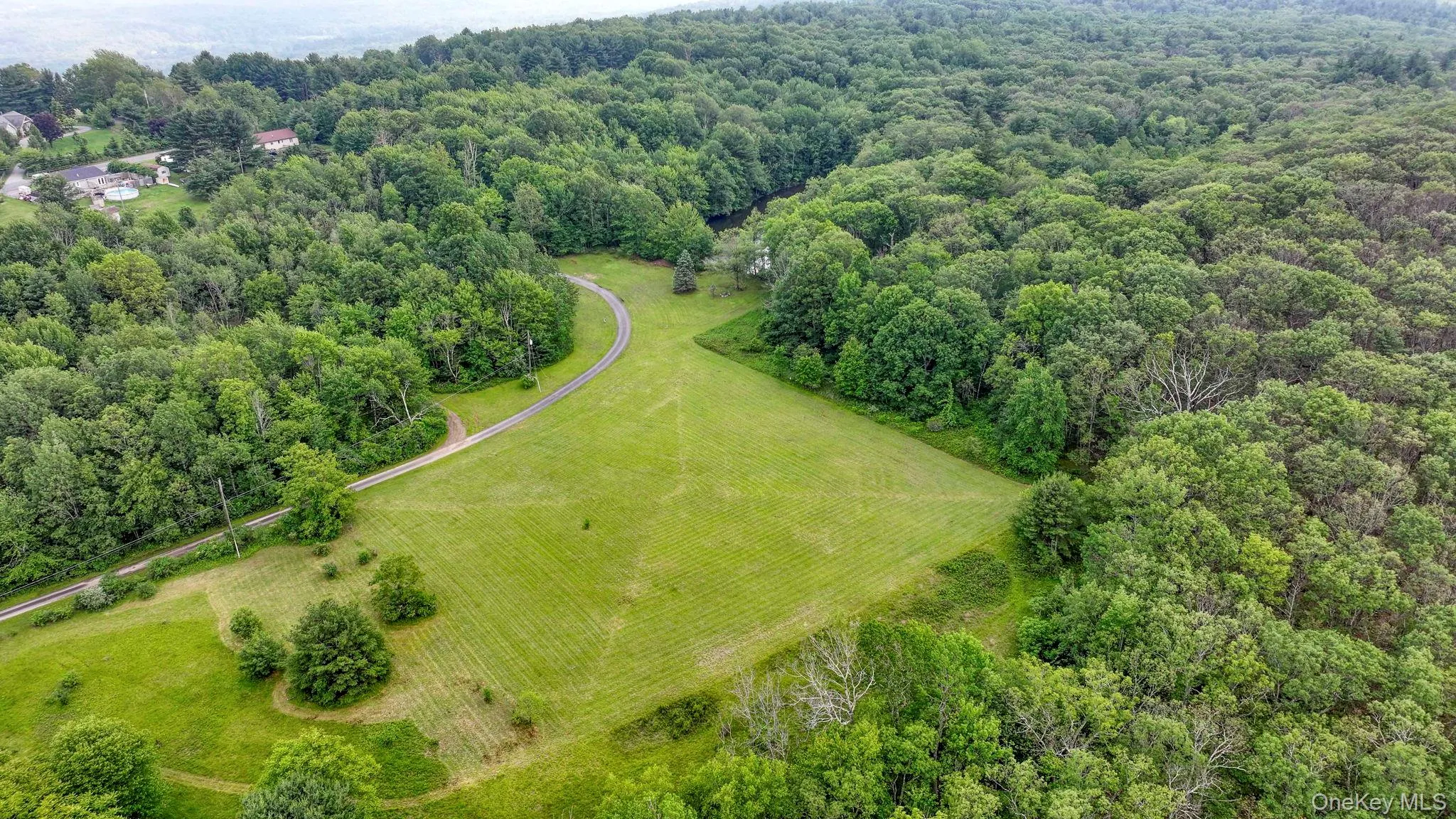 Overview of rural landscape featuring a heavily wooded area Overview of rural landscape featuring a heavily wooded area