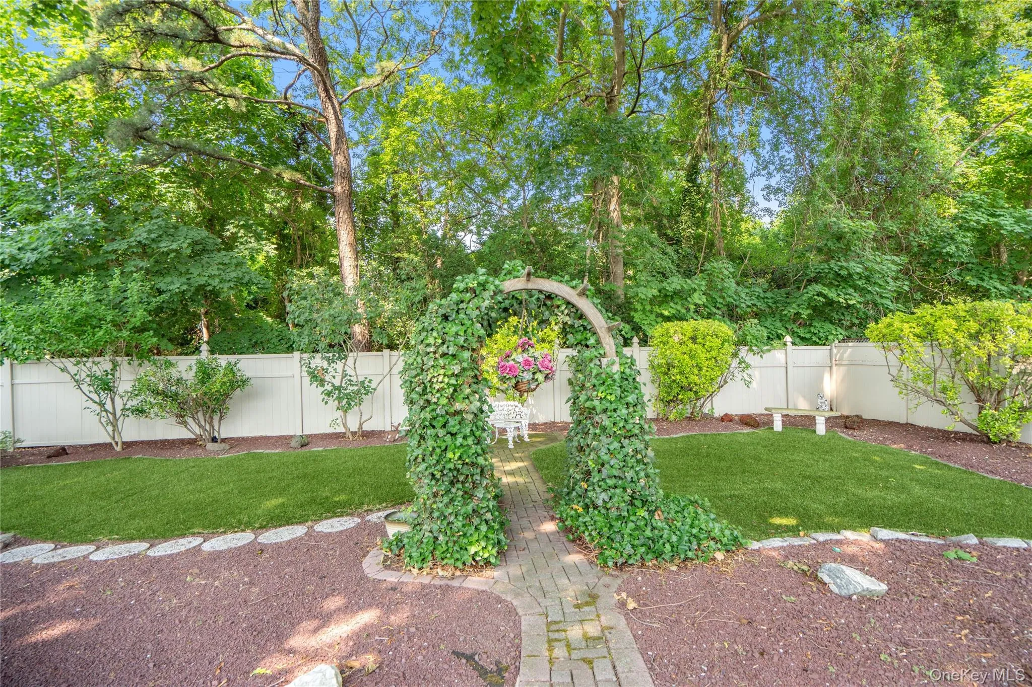 a paver stone walkway through the arbor... a paver stone walkway through the arbor...