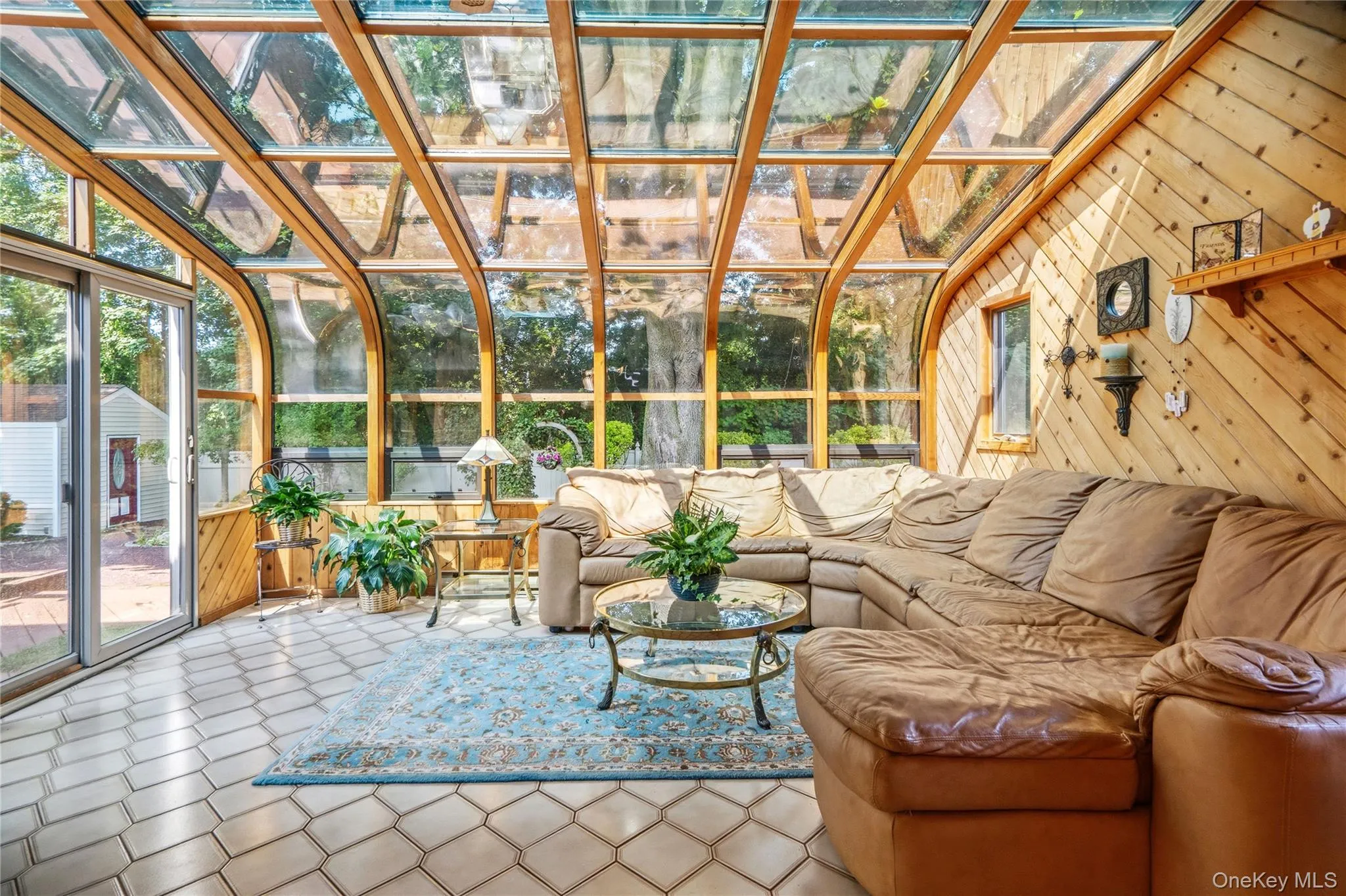 This stunning room is filled with natural light thanks to the dramatic full-glass walls & ceiling. This stunning room is filled with natural light thanks to the dramatic full-glass walls & ceiling.