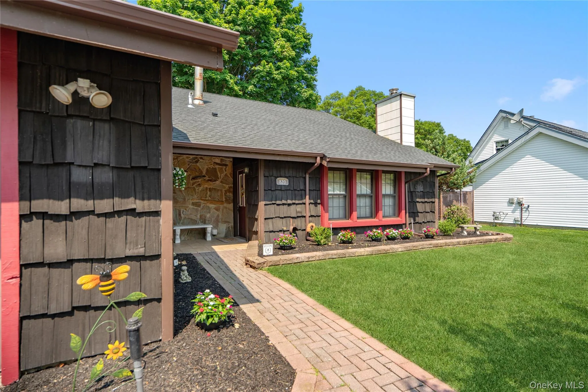 The paver-stone walkway leads you off the doublewide driveway and to your front door. The paver-stone walkway leads you off the doublewide driveway and to your front door.